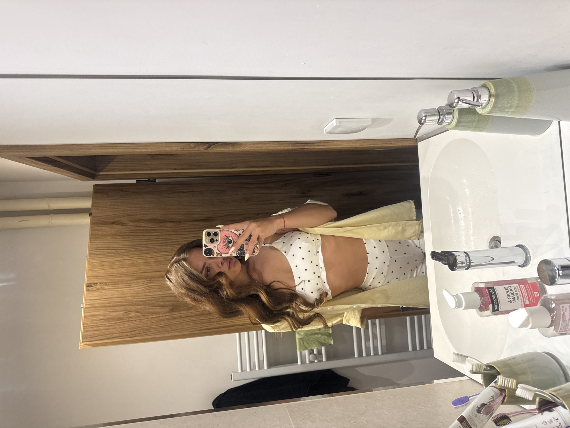 Bathroom mirror selfie in polka dots and yellow, Plovdiv