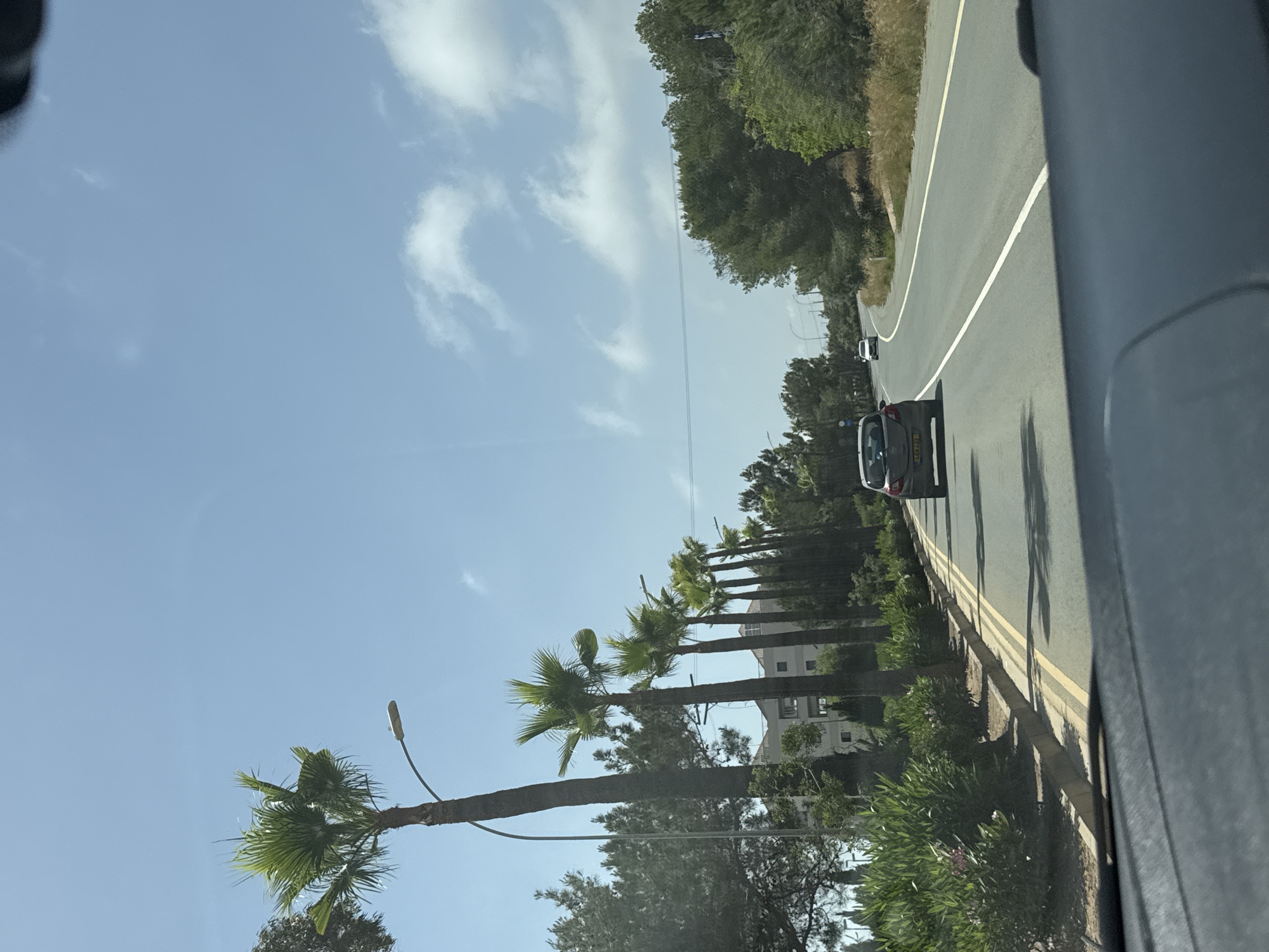 Vehicle travels coastal road in Ayia Napa, Cyprus