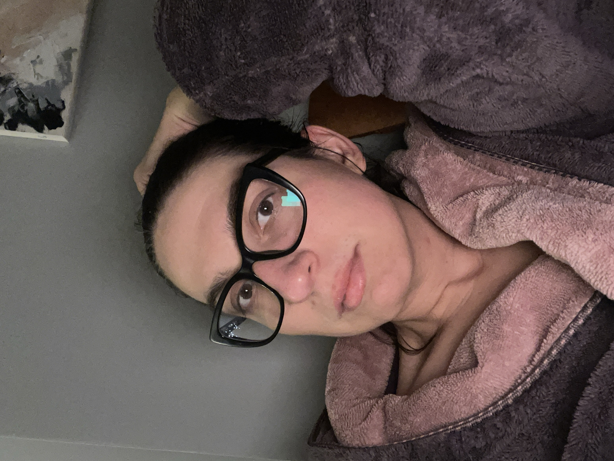 Woman relaxes in bathrobe, Sofia evening scene captured