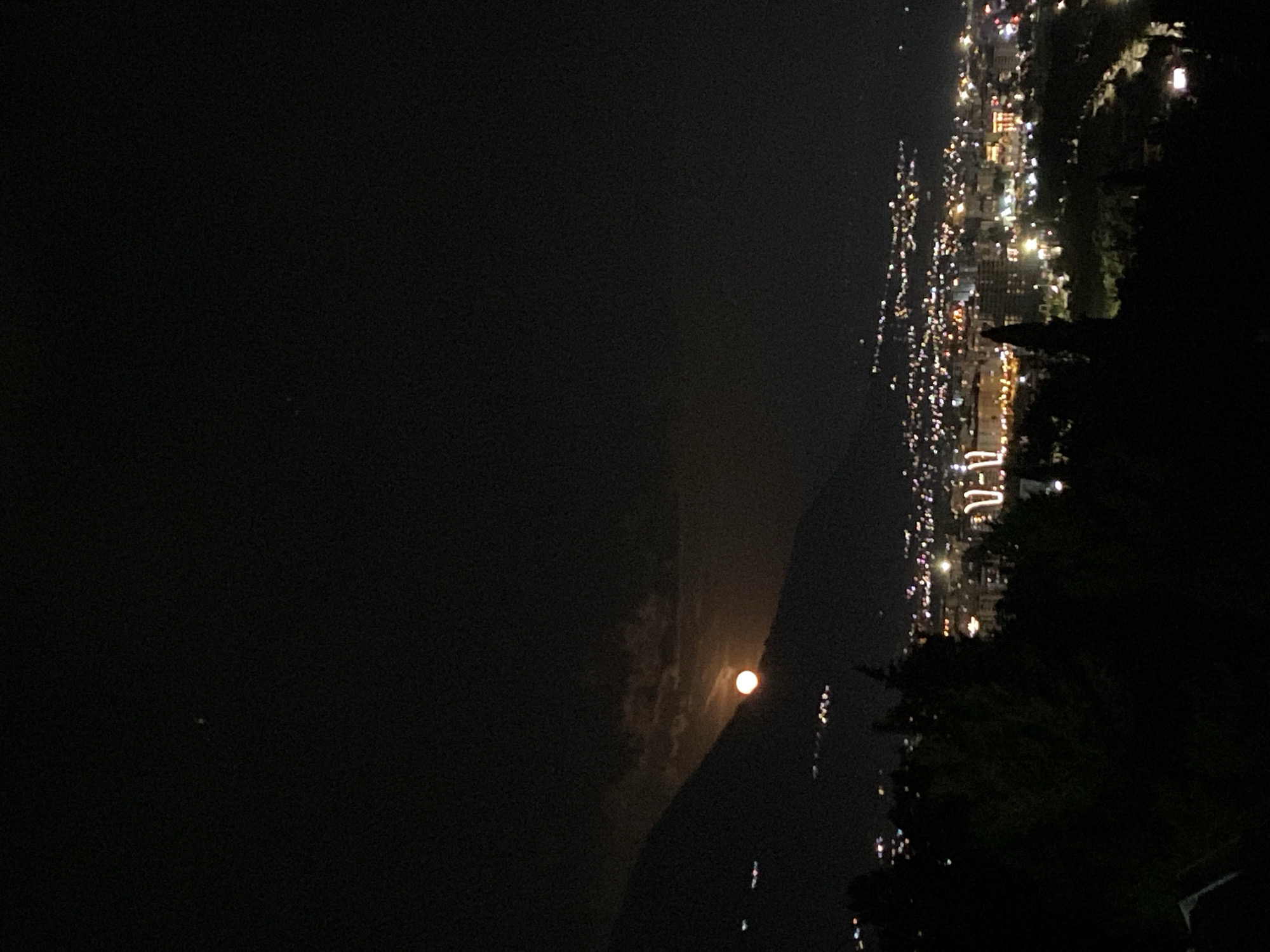 Full moon rises over coastal Montenegro town