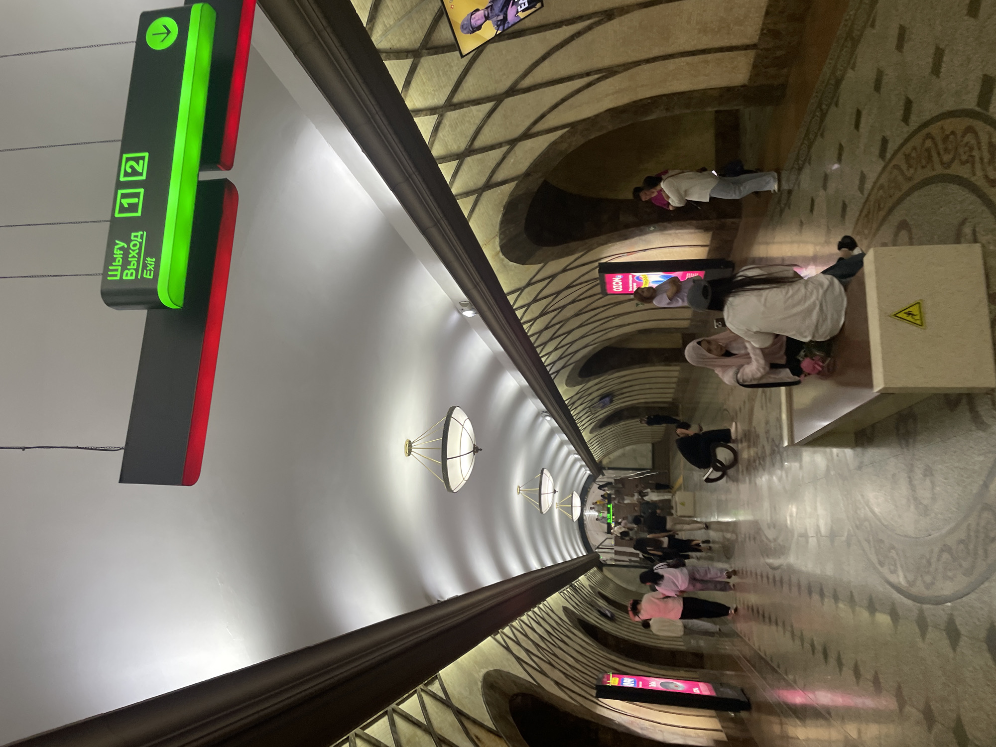 Almaty streets, metro stations, and a late-afternoon soccer game