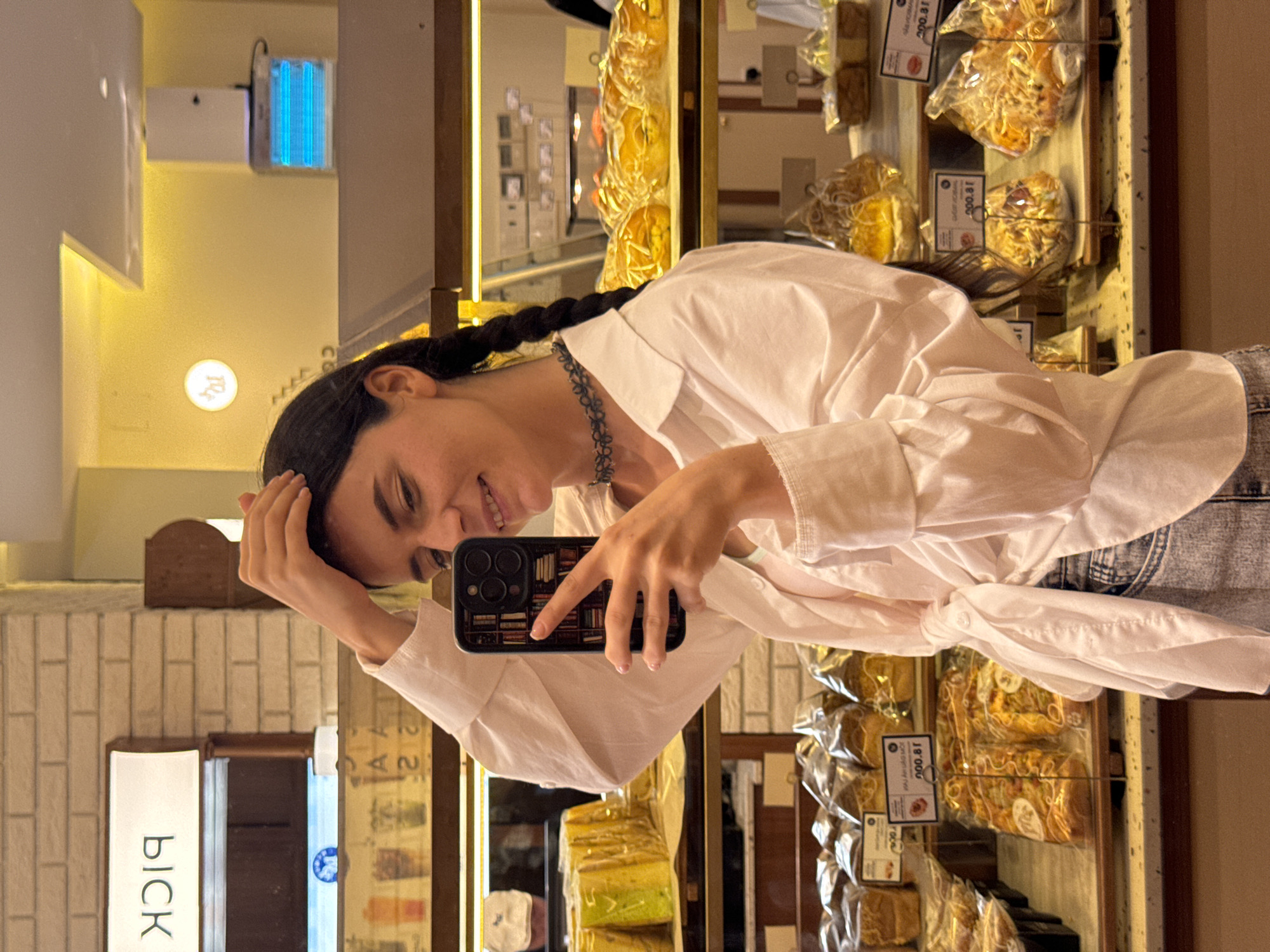 Woman documents bakery visit with photos in Phan Thiết