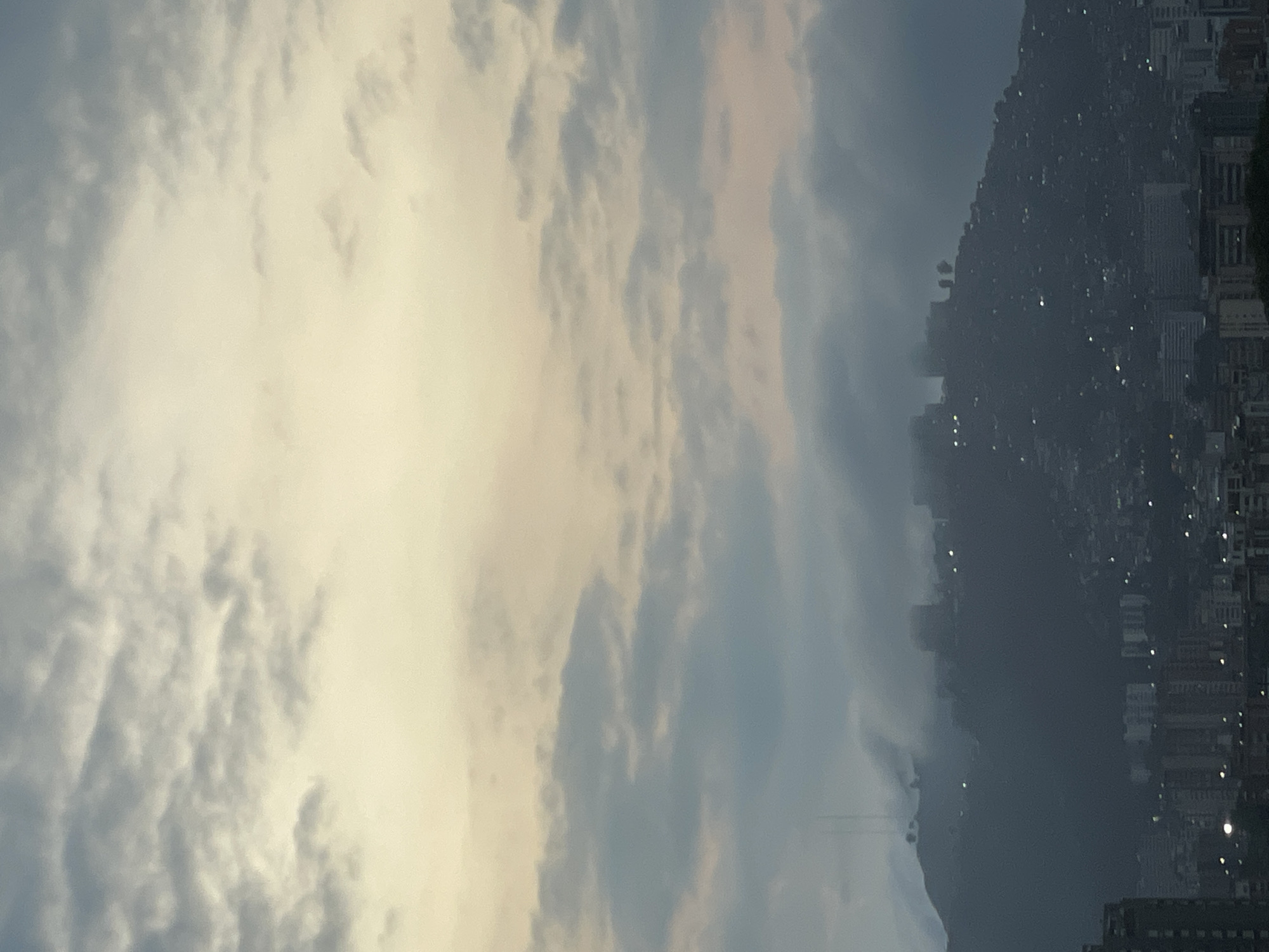 Caracas hillside cityscape documented under cloudy evening skies