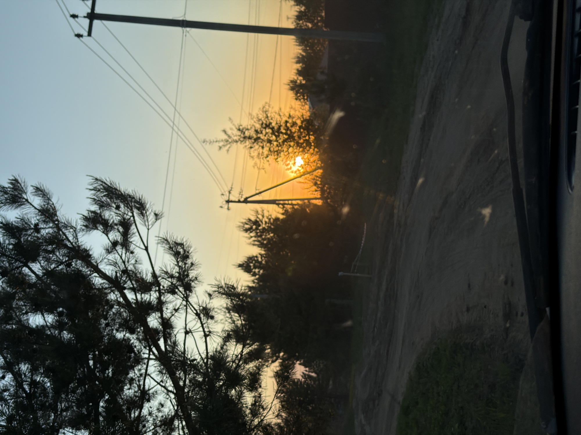 Woman enjoys sunset beer break on rural Russian roadside