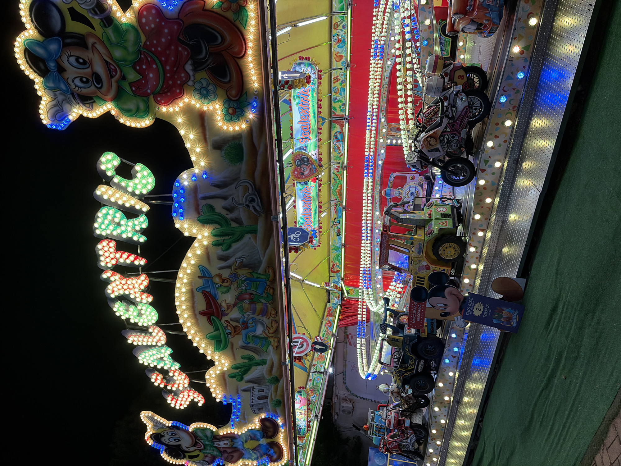 Colorful carnival ride lit up at night
