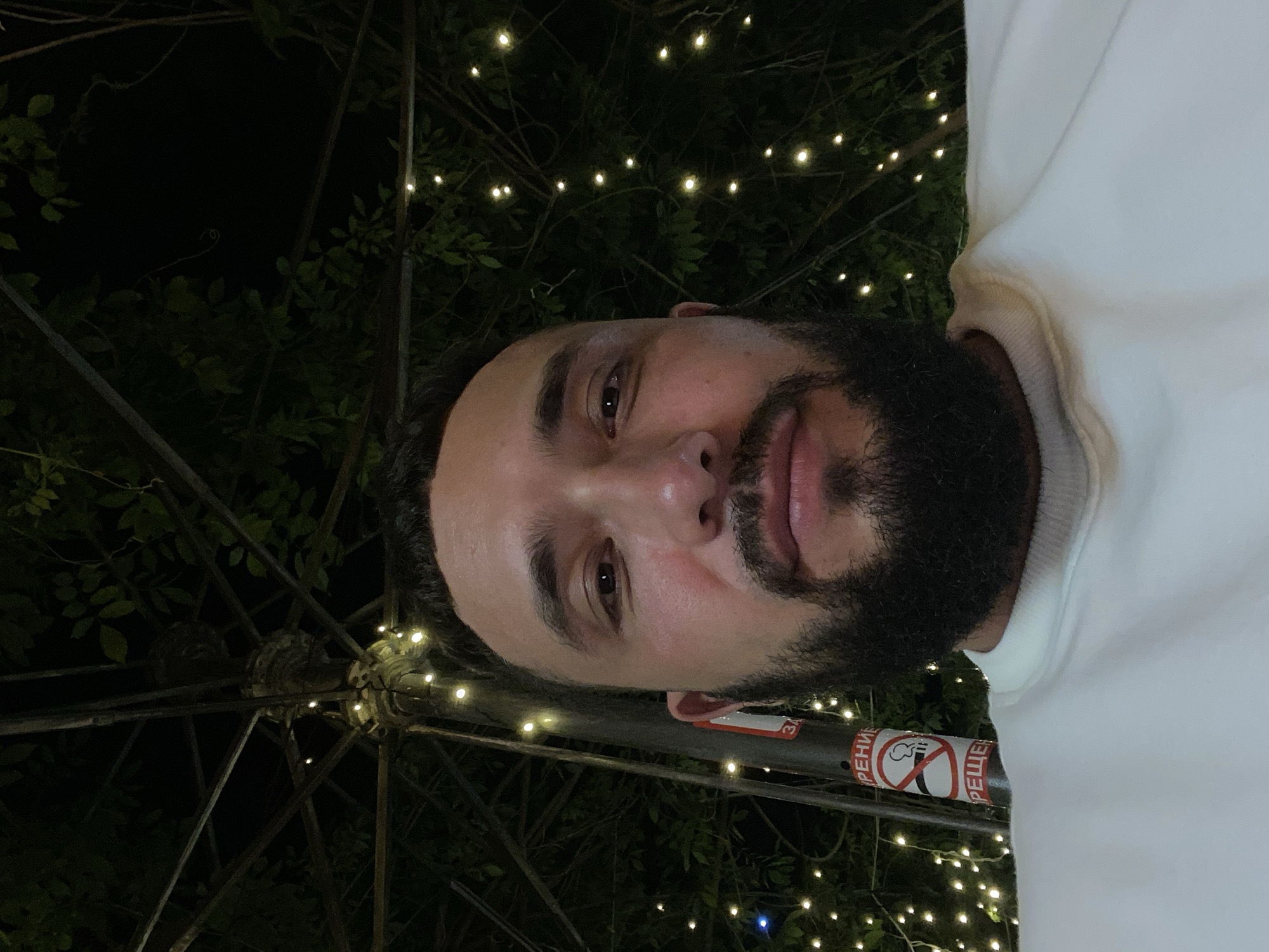 Nighttime selfies under string lights in Makhachkala