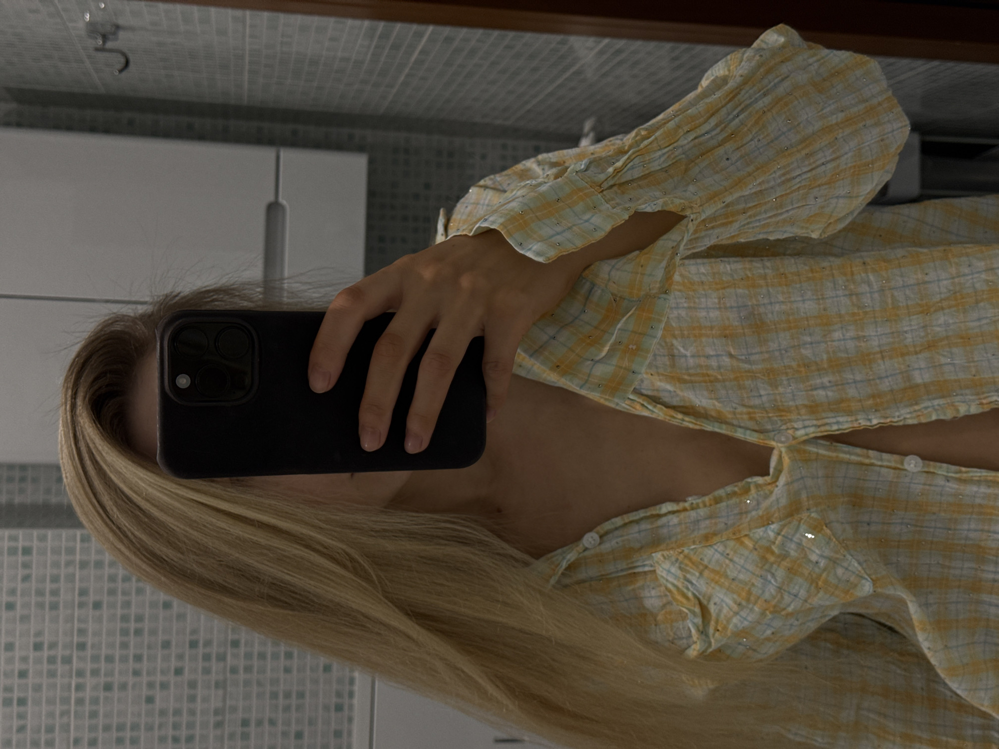 Mirror selfie in a Moscow bathroom, glittery plaid shirt