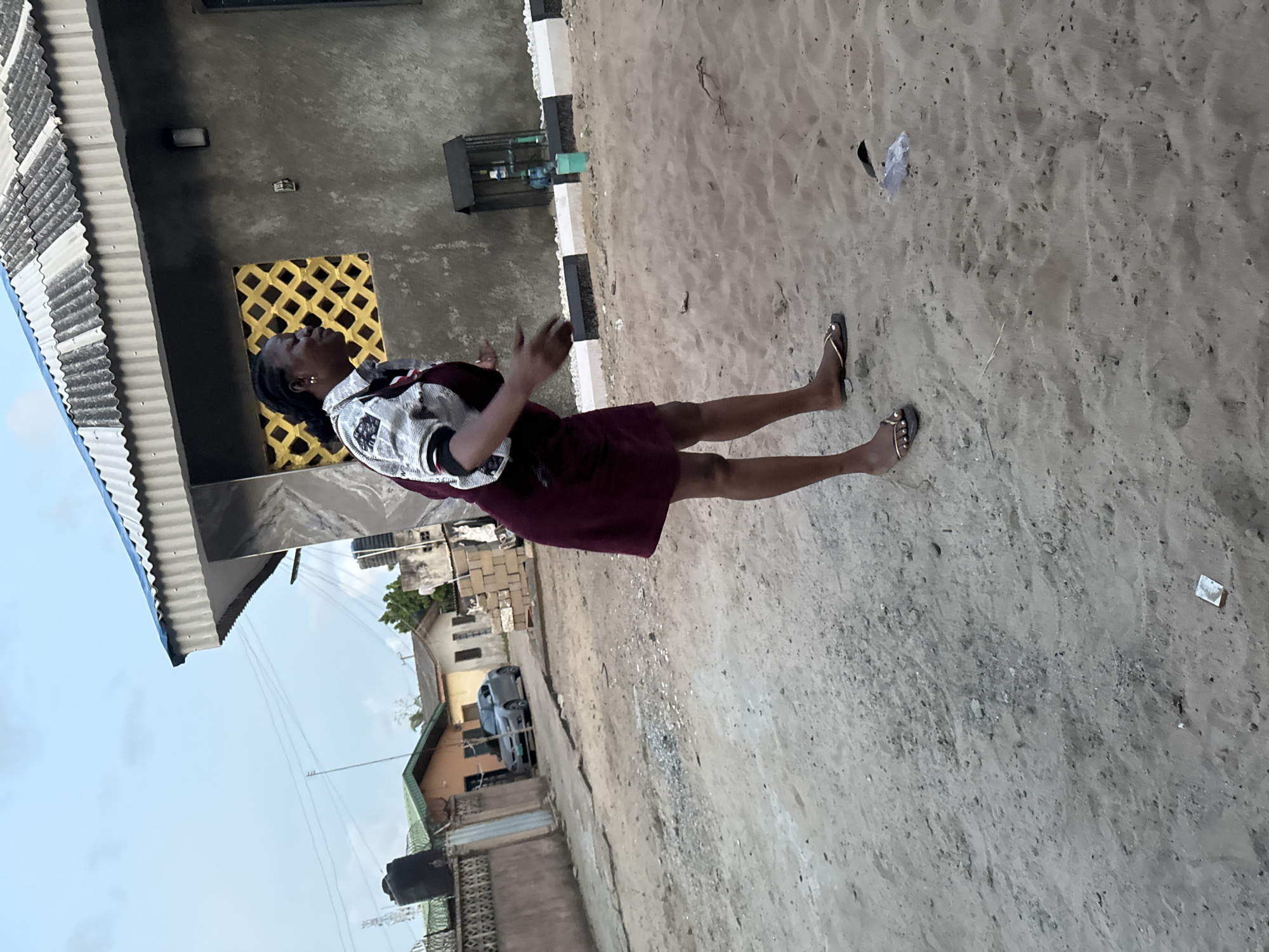 Woman dancing in residential Ajara neighborhood captures local life
