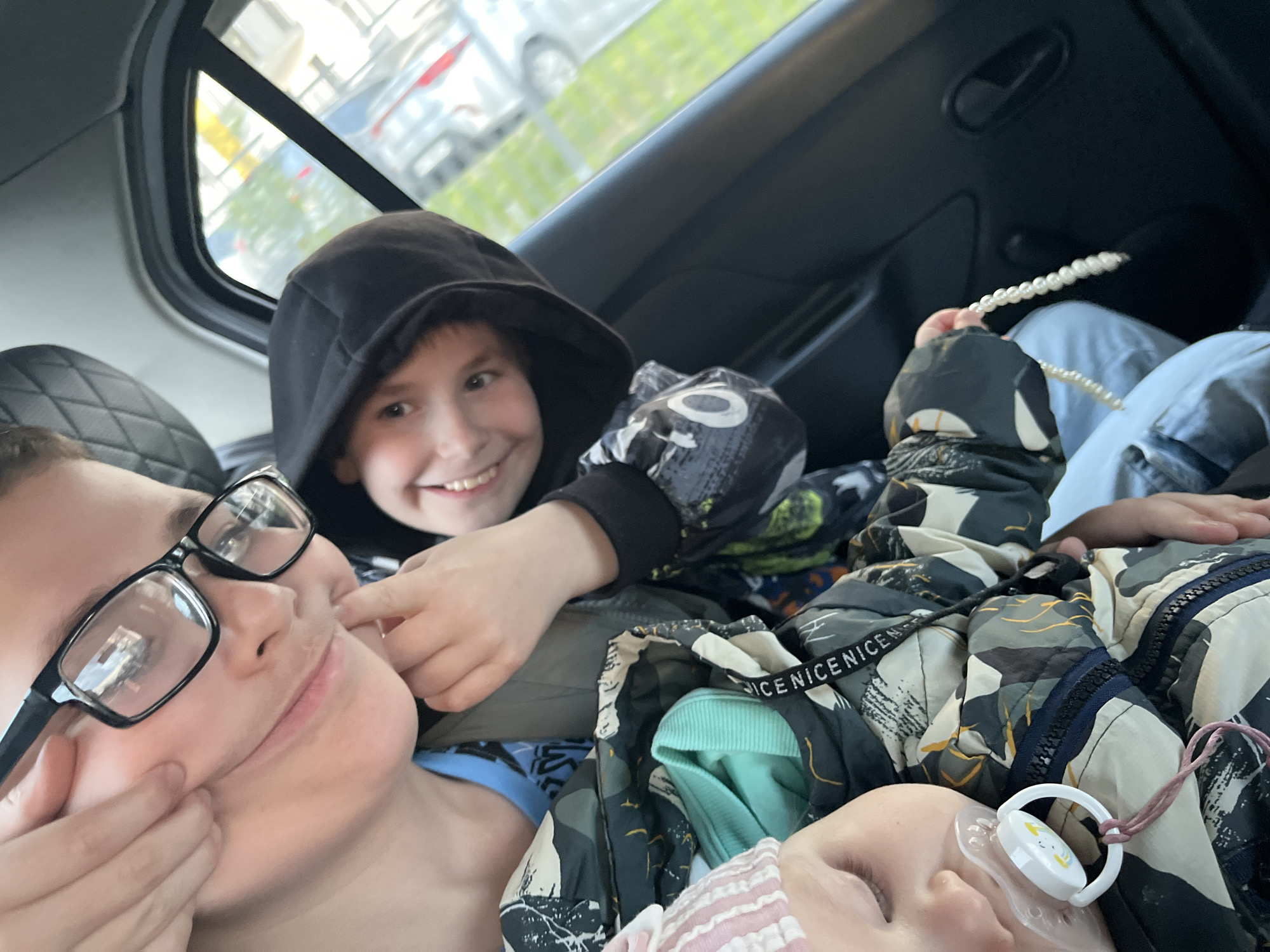 Family group travels together in car in Sirius, Russia