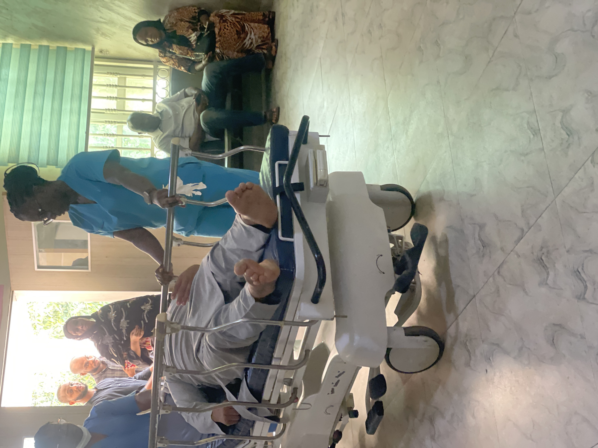 Inside a hospital in Abuja during an active patient care moment.