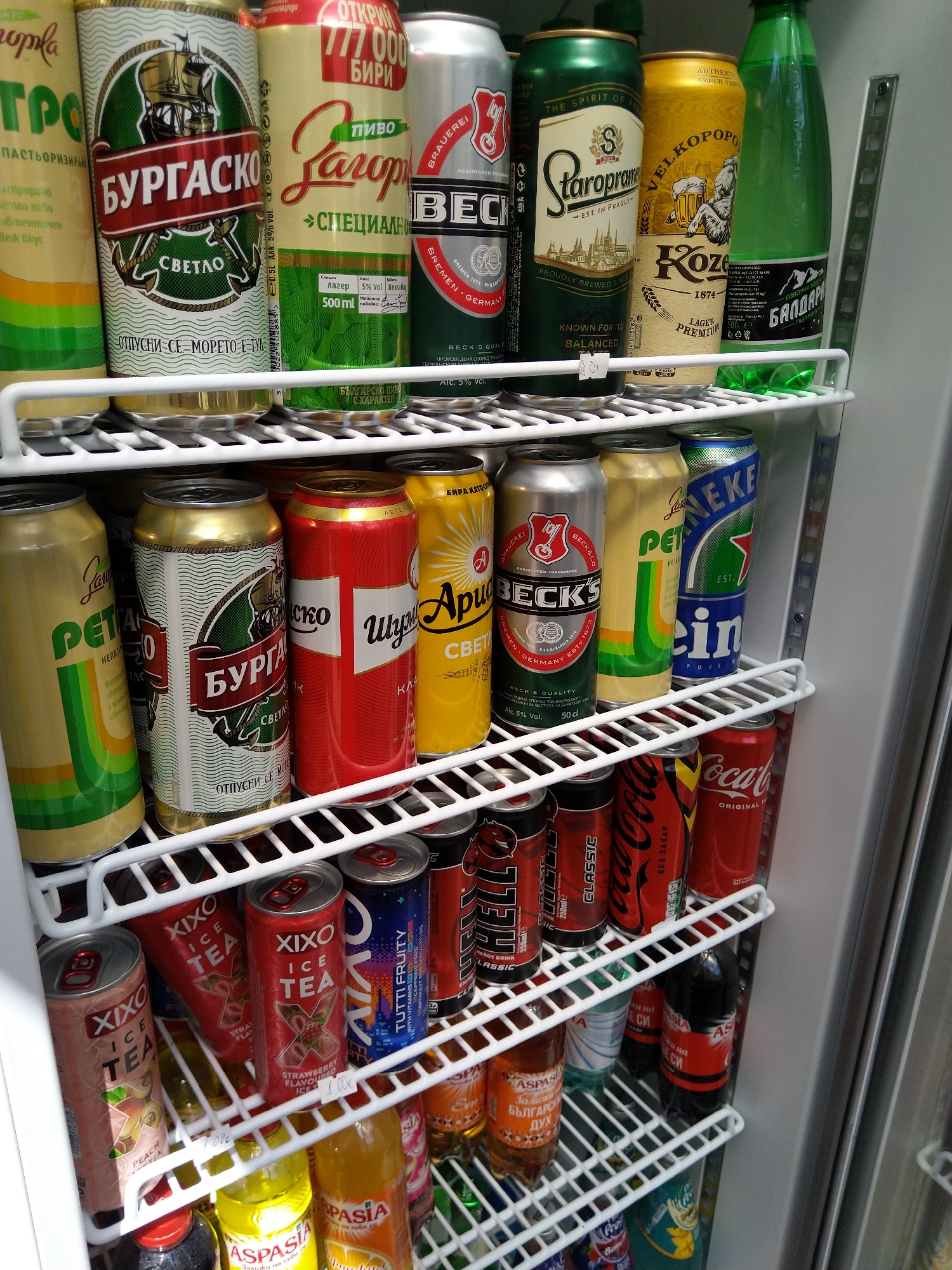 Convenience store fridge stocked with canned drinks in Kyustendil