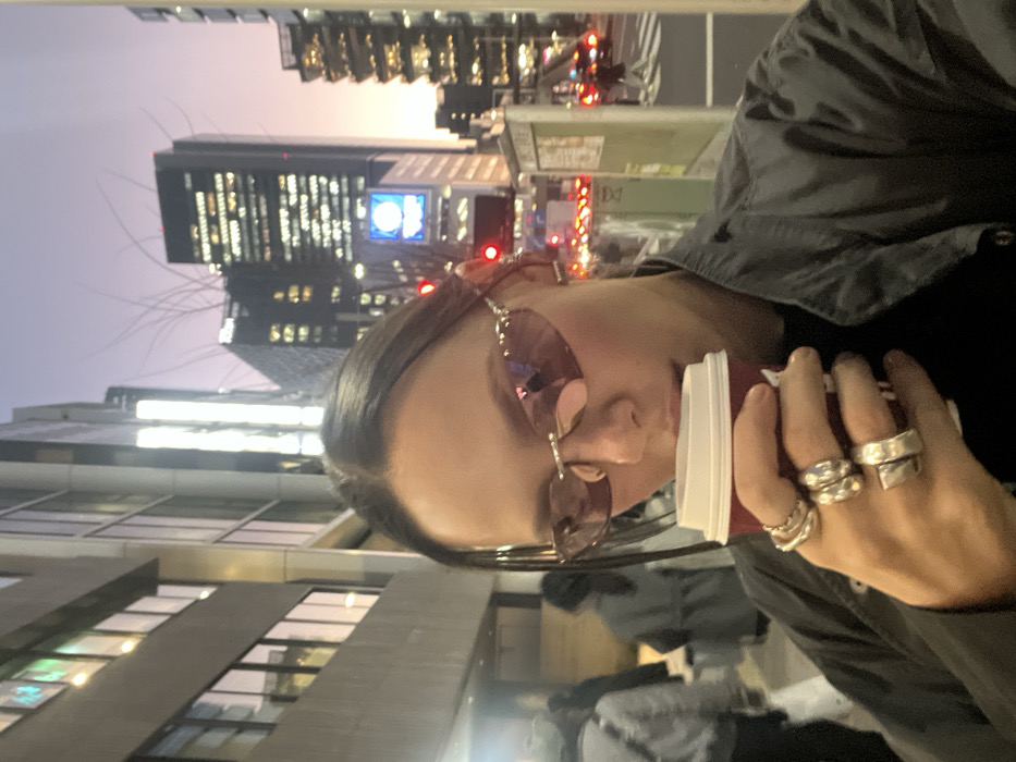 Woman in tinted sunglasses photographed on Shibuya street