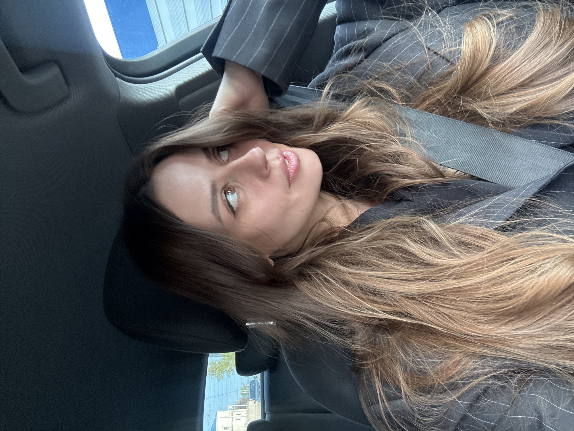 Woman in business attire observed in car in Krasnoyarsk