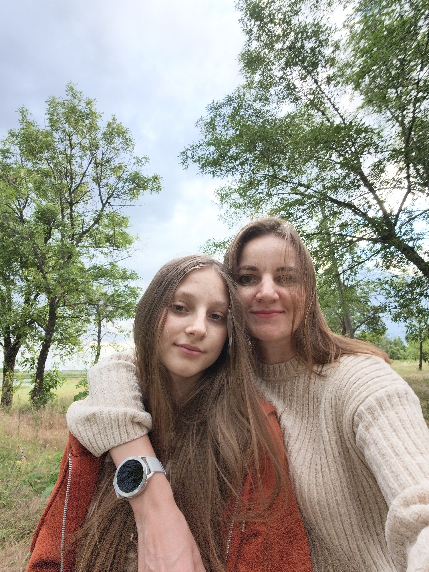 Wildflowers and storm skies along a Kryvyi Rih riverbank