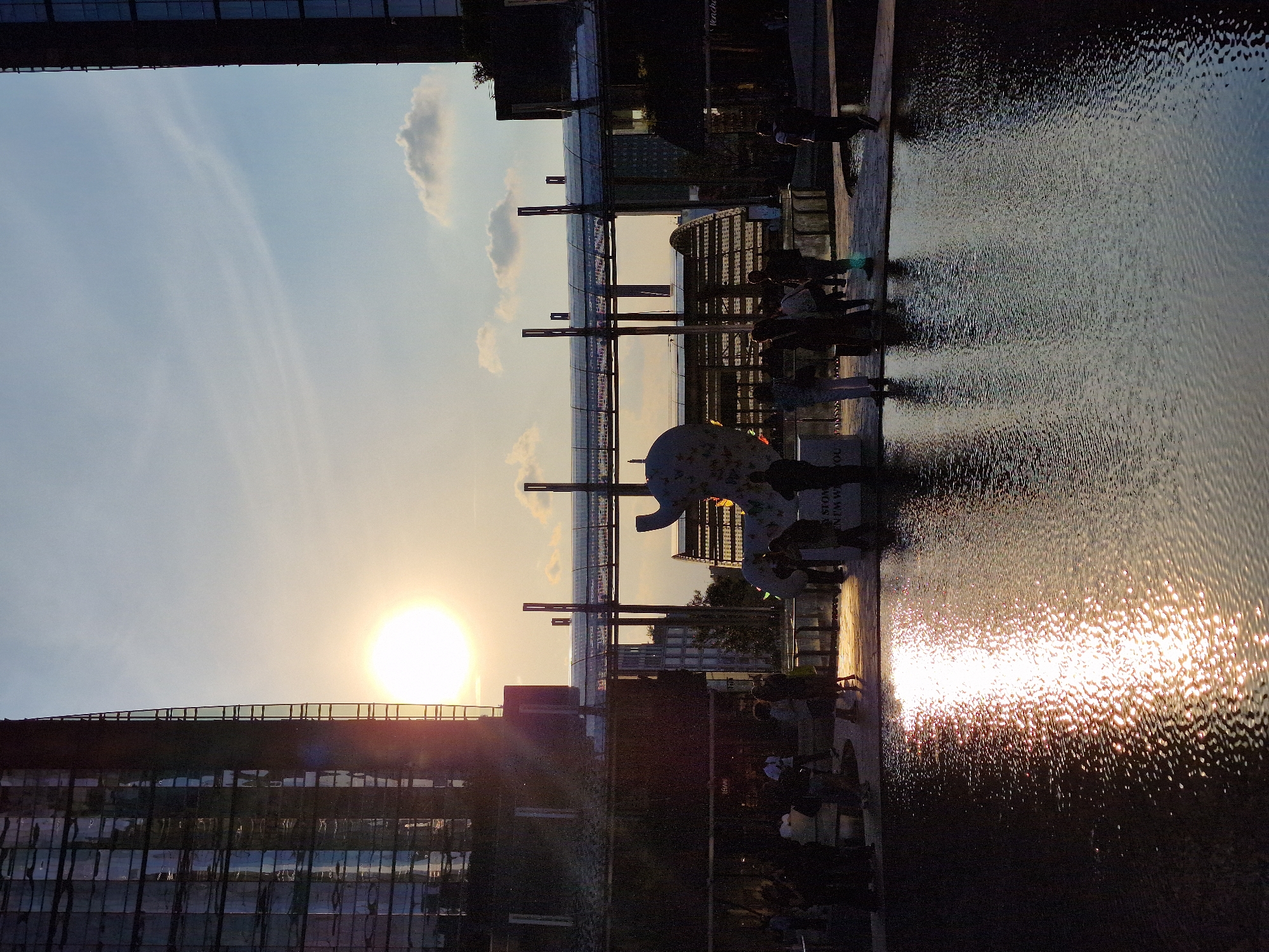 Golden sunset observed along Milan waterfront