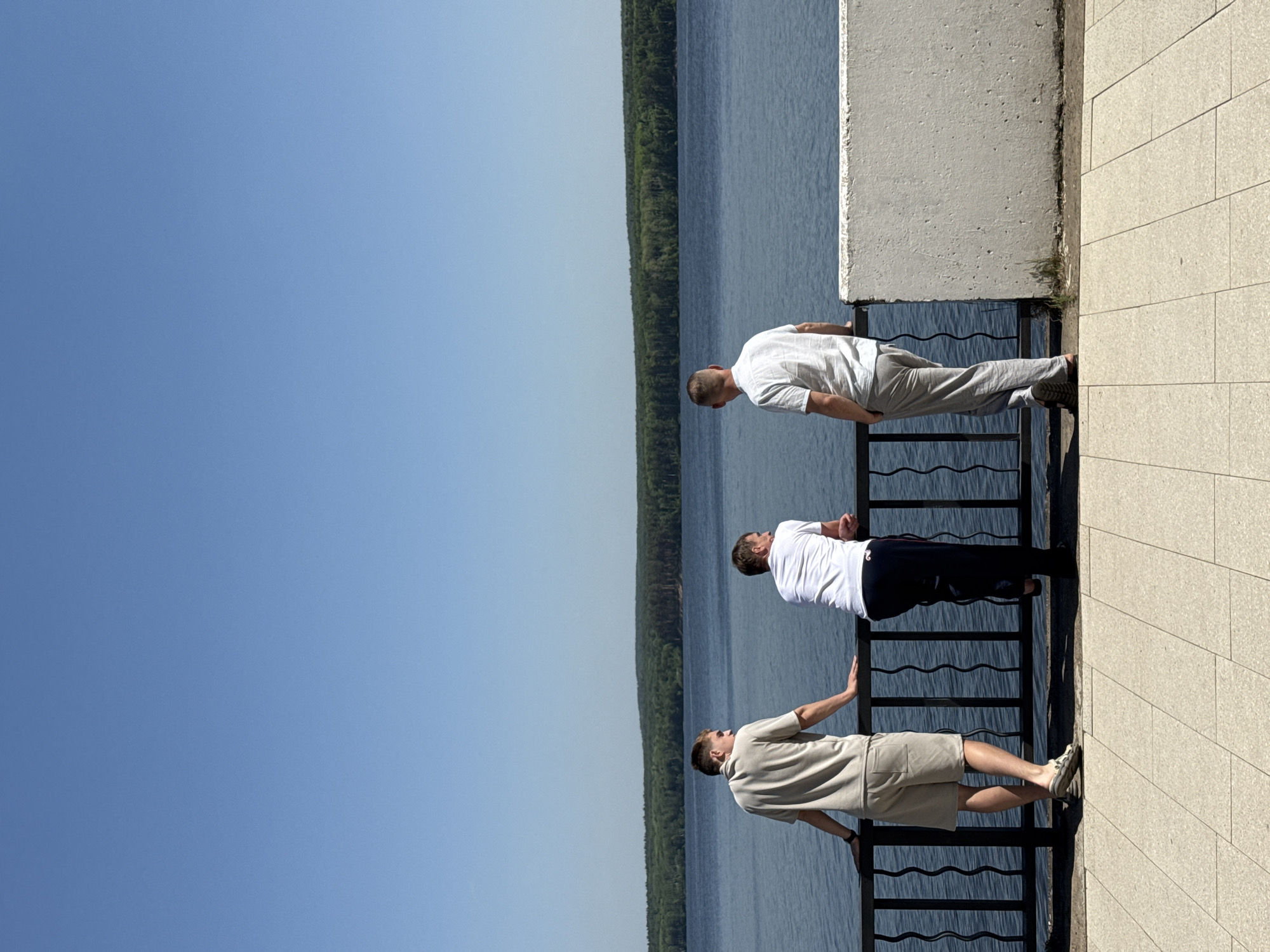 Morning waterfront activity documented along pedestrian walkway