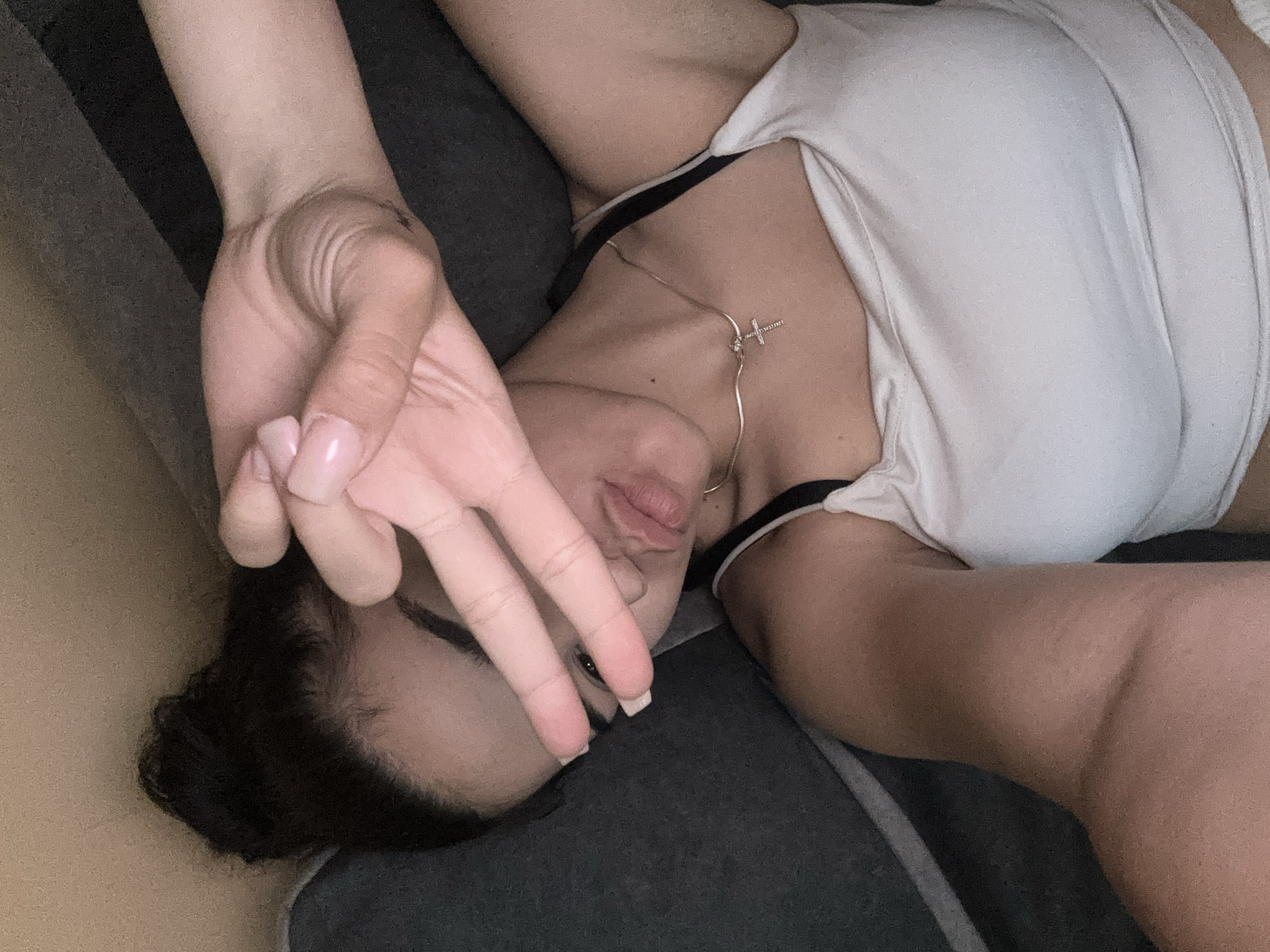 Woman takes selfies on couch in Gabrovo apartment