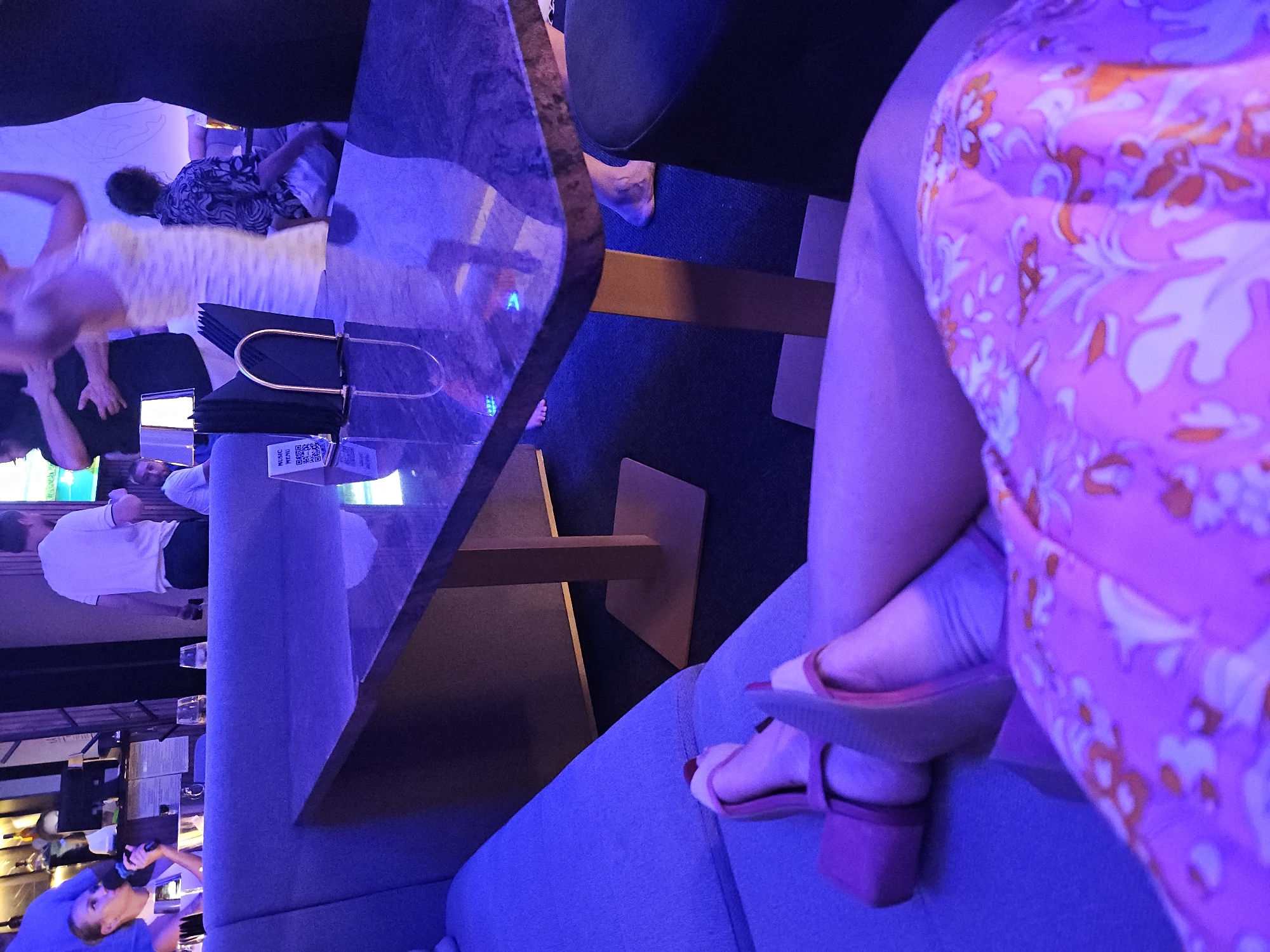 Karaoke Night Documented at Blue-Lit Lounge Venue