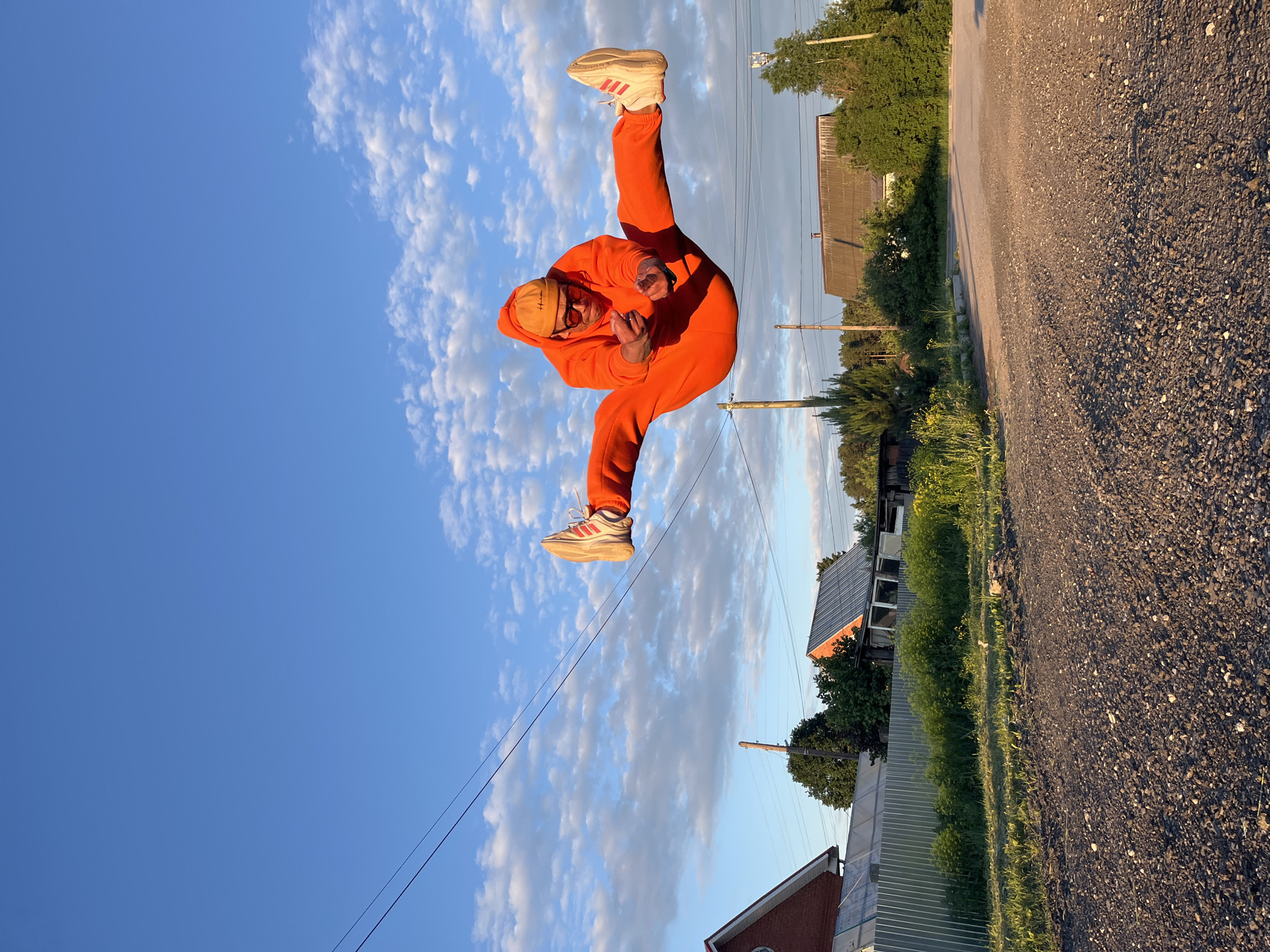 Orange tracksuit photoshoot with child captured in Chaikovsky Russia