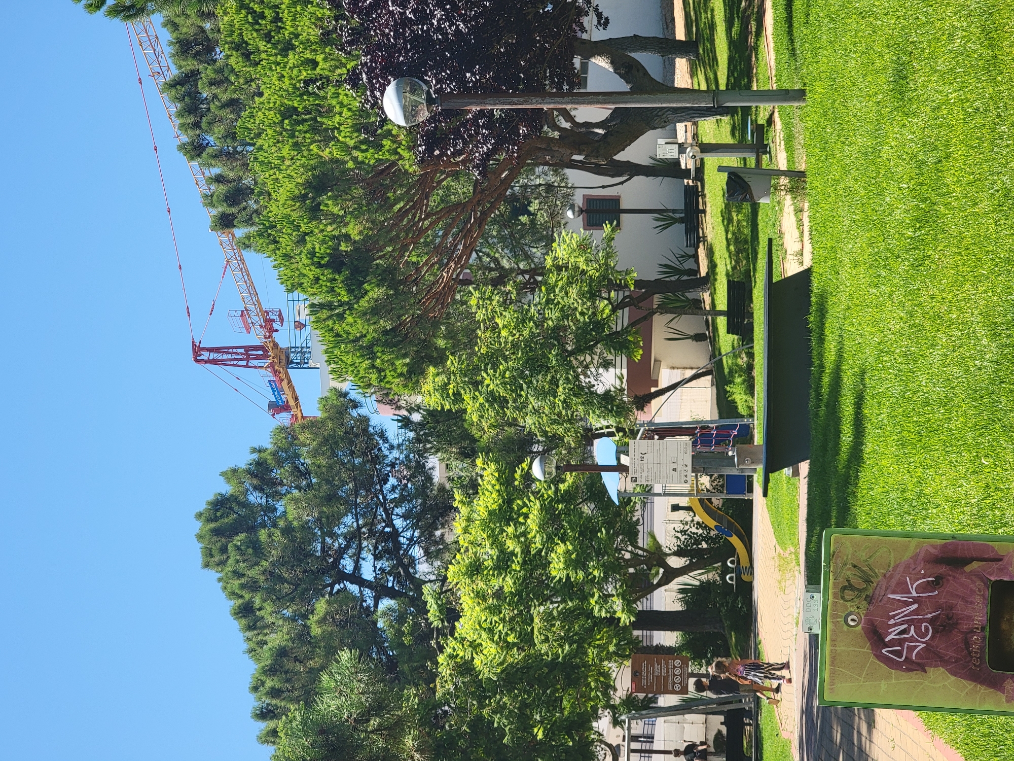 Sunny afternoon stroll through Quarteira's streets and park