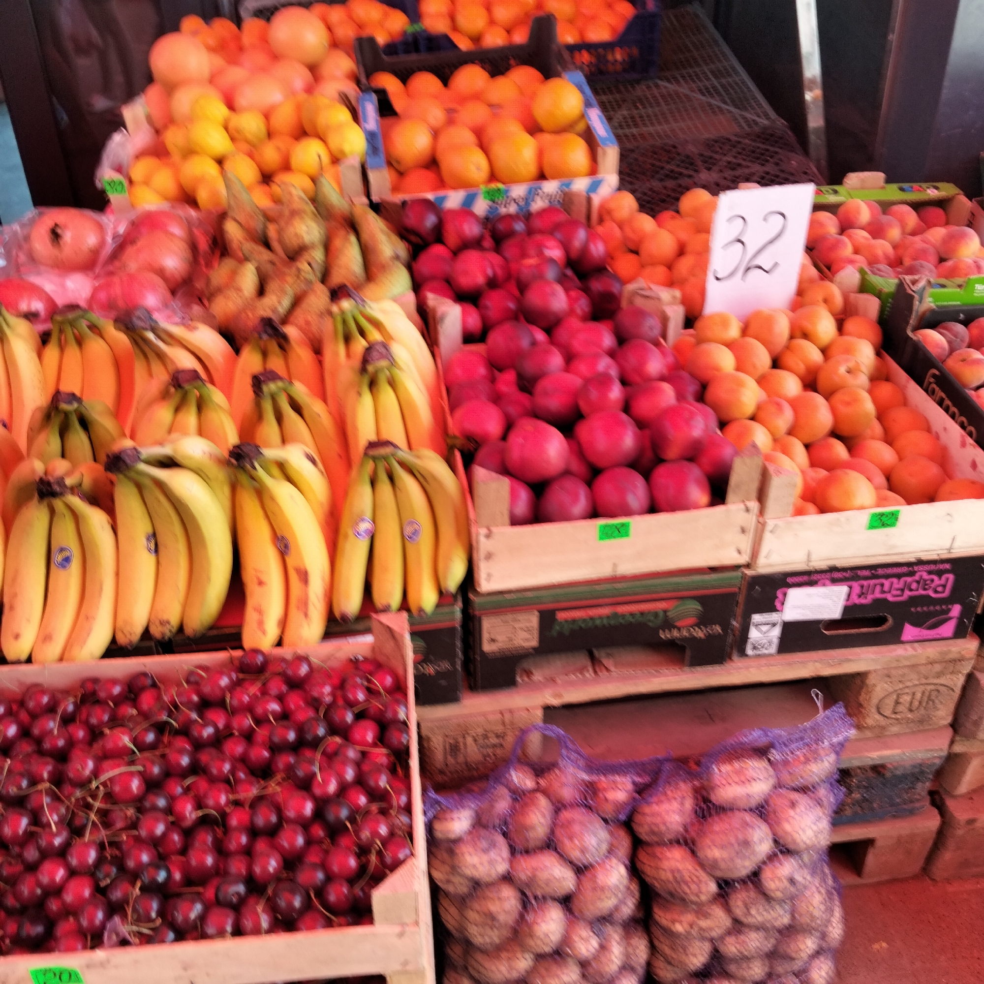 Fresh cherries and summer produce at a Cupcini market stall
