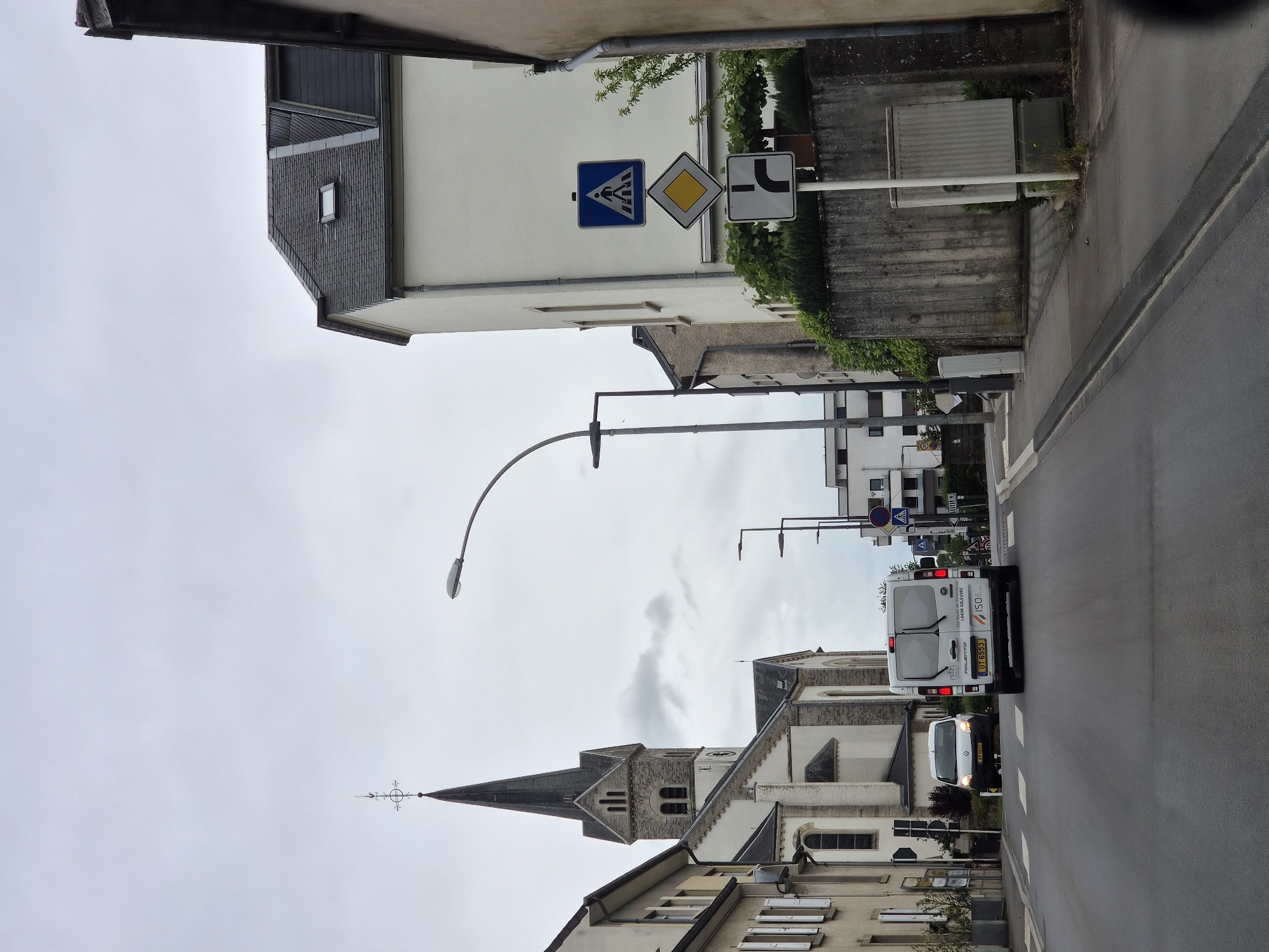 Overcast street scene documented in Leudelange, Luxembourg