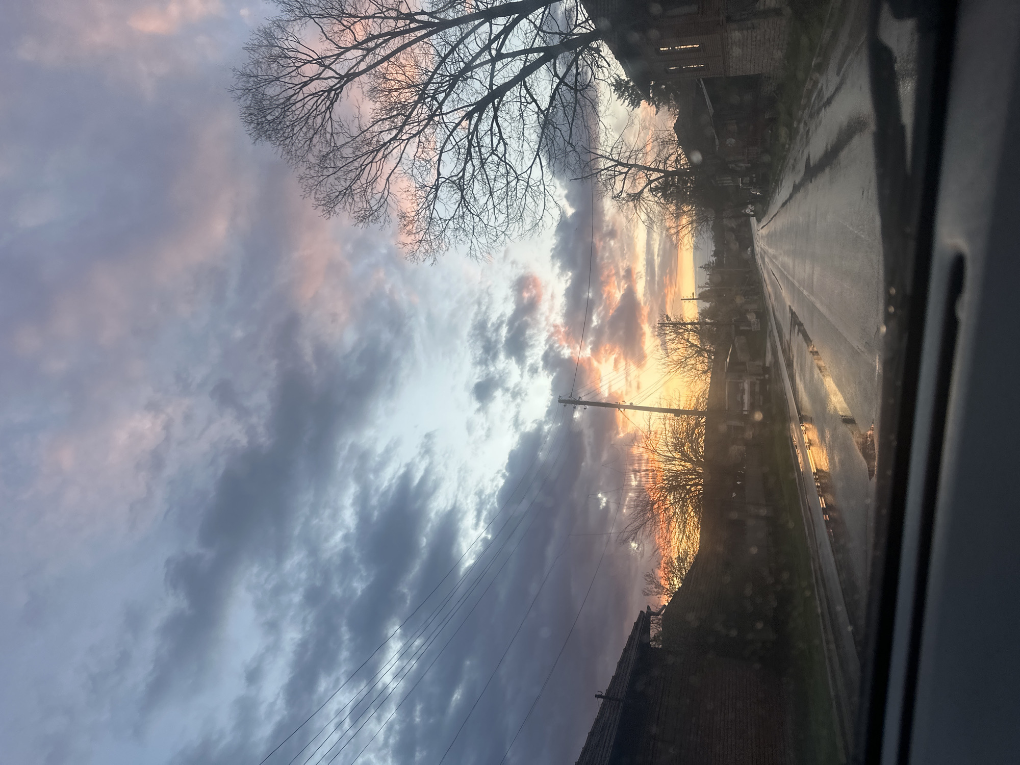 Motorist captures dramatic sunset through rain in Bulgarian village