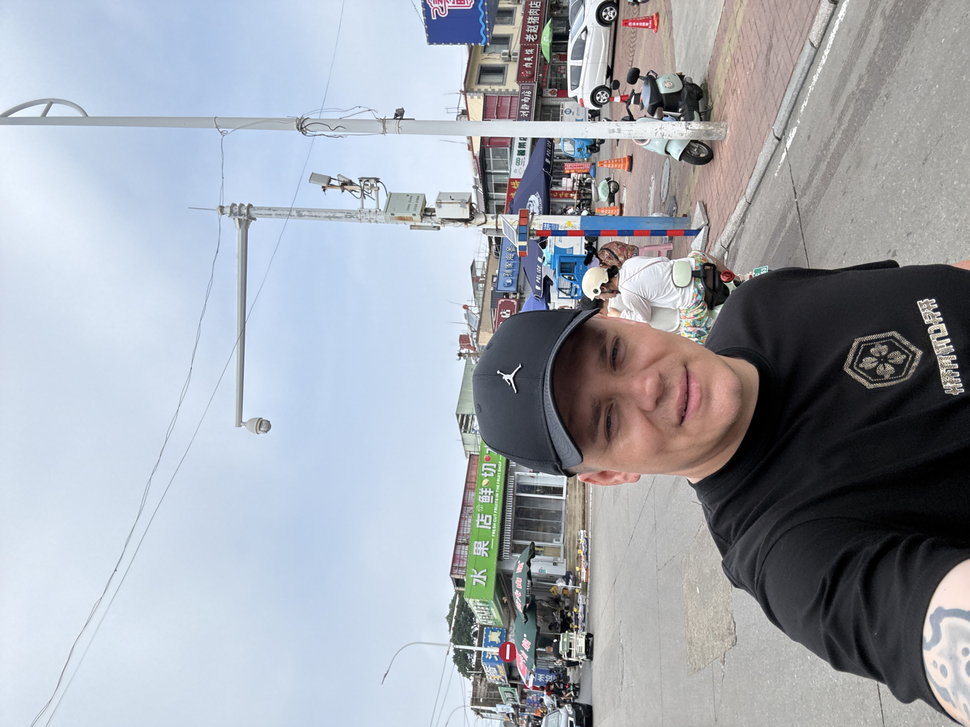 Everyday street life along a Qinhuangdao commercial strip