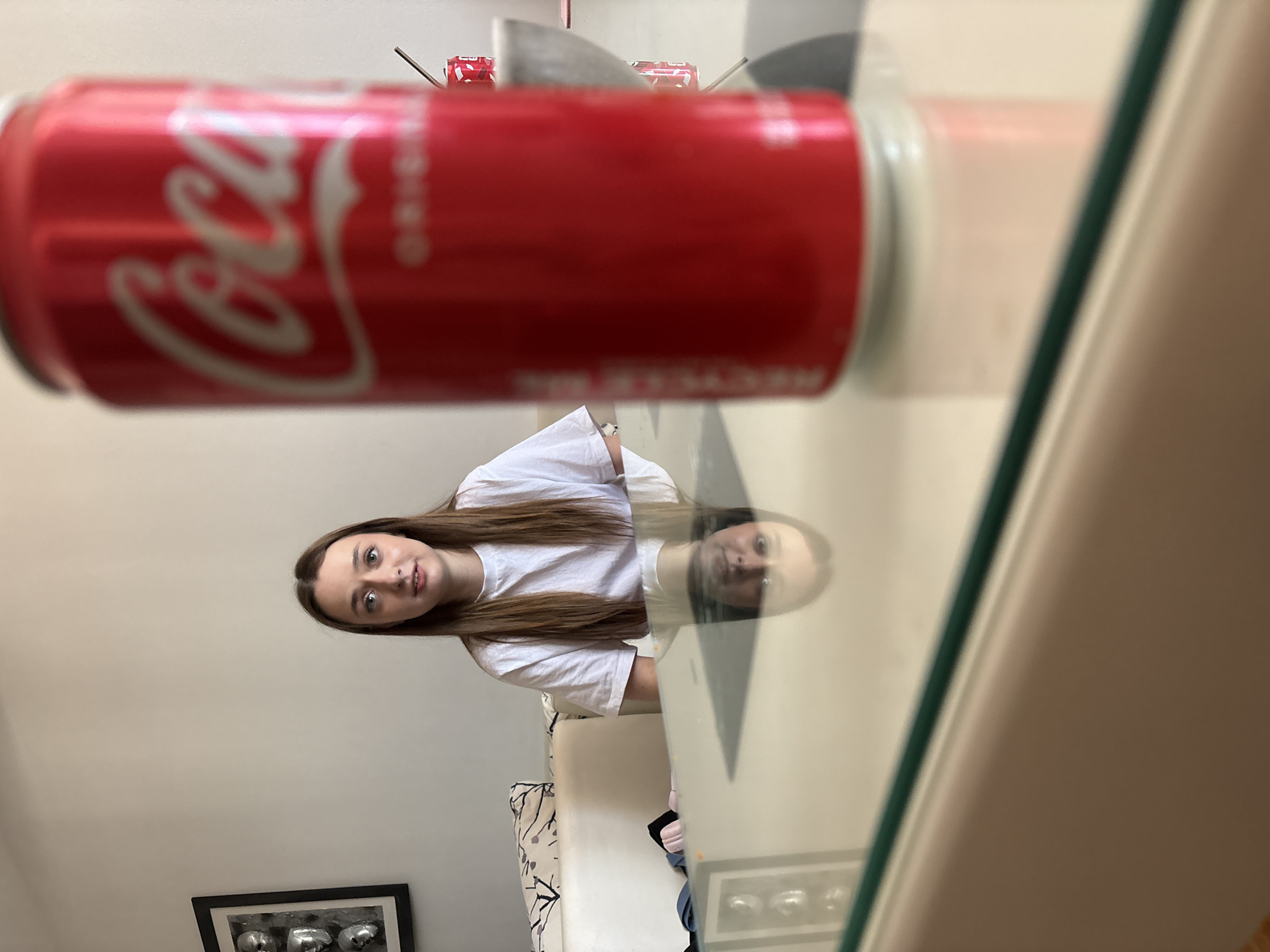 Woman enjoys afternoon snacks and Coca-Cola in Kragujevac cafe