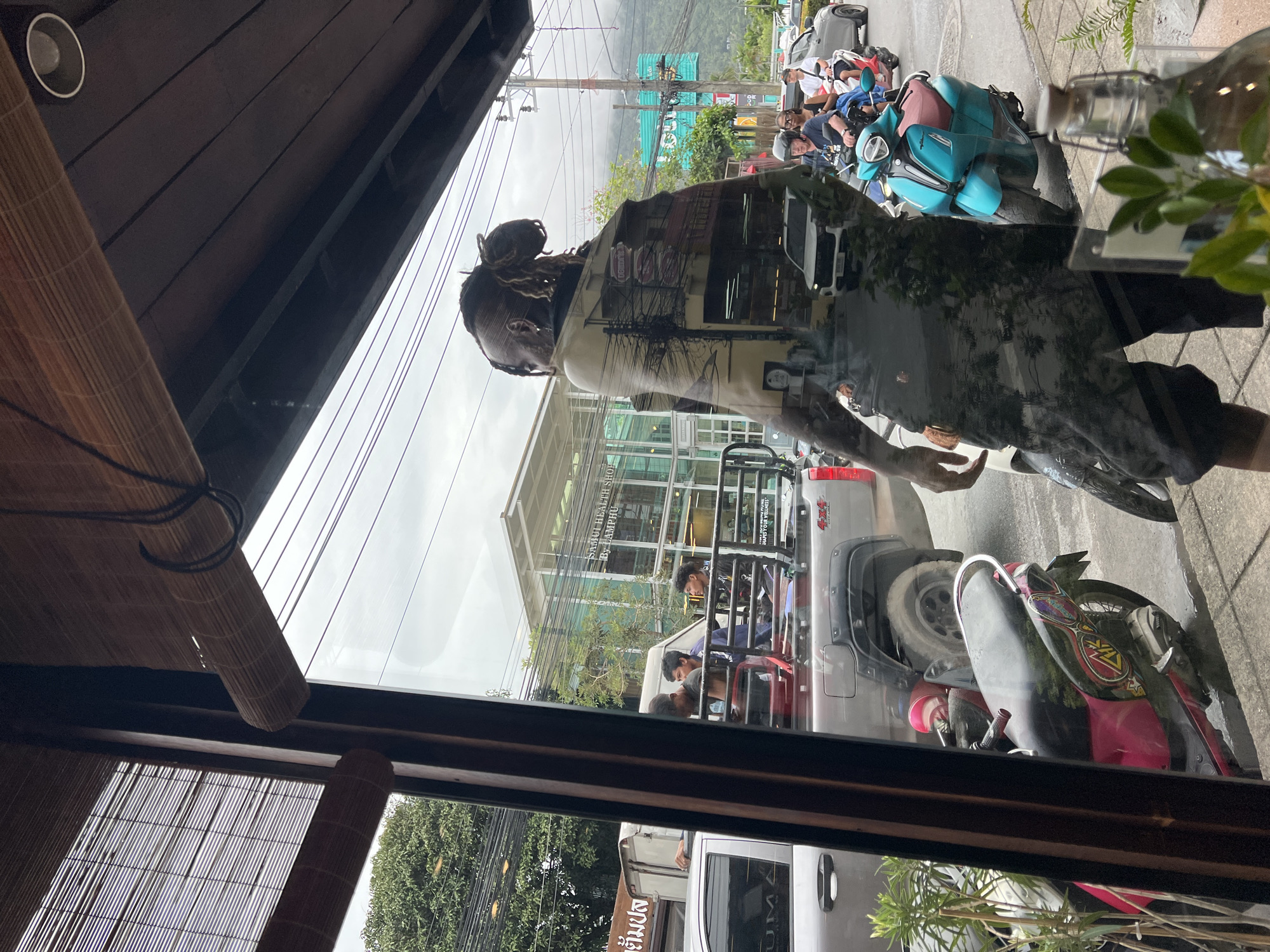 Woman visits health food cafe in Baan Lamai Thailand