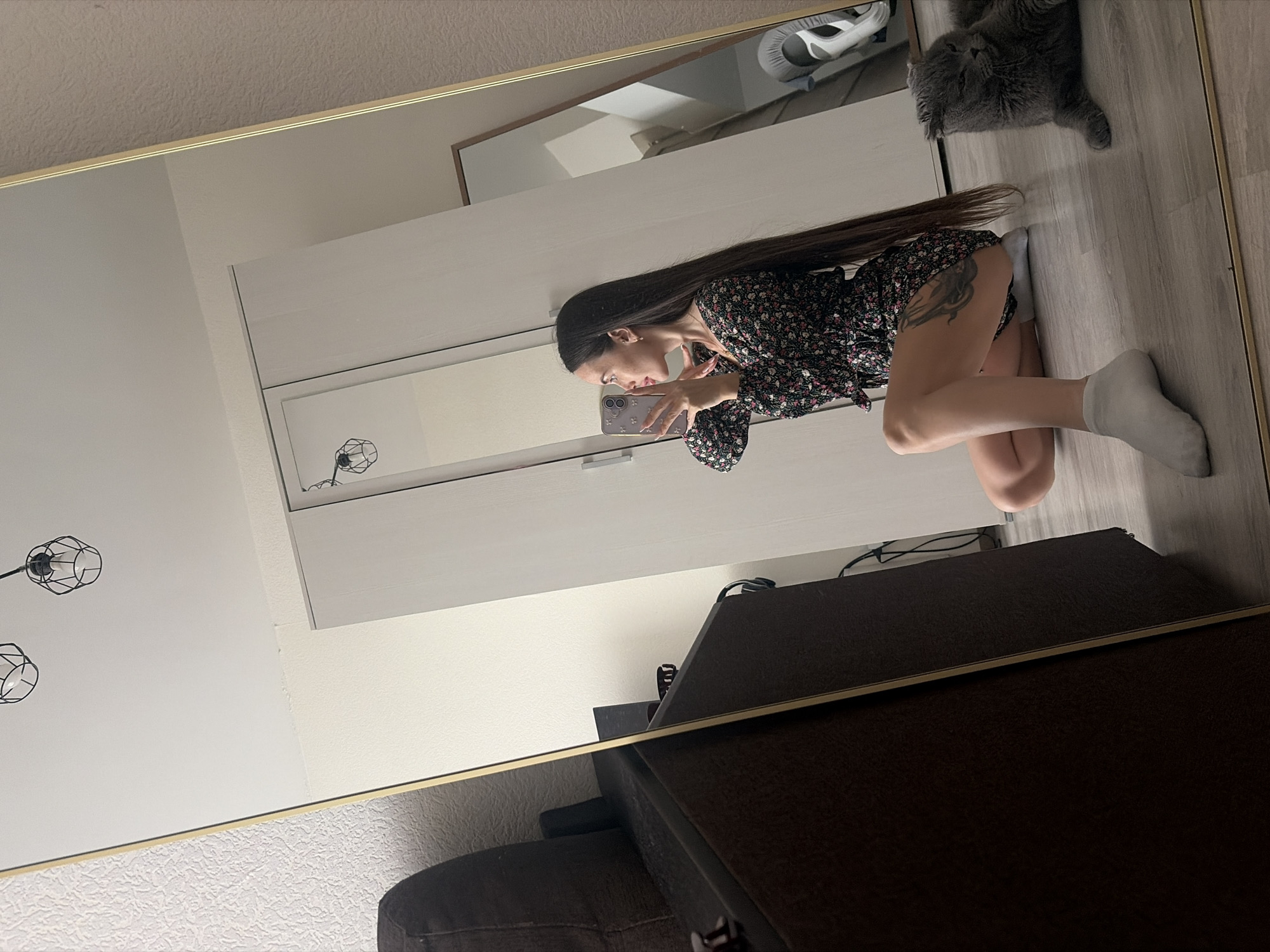 Woman takes mirror selfies indoors in Saint Petersburg