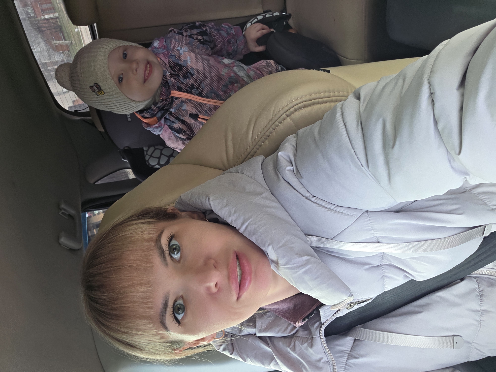 Mother and child take car selfie in Chaikovsky