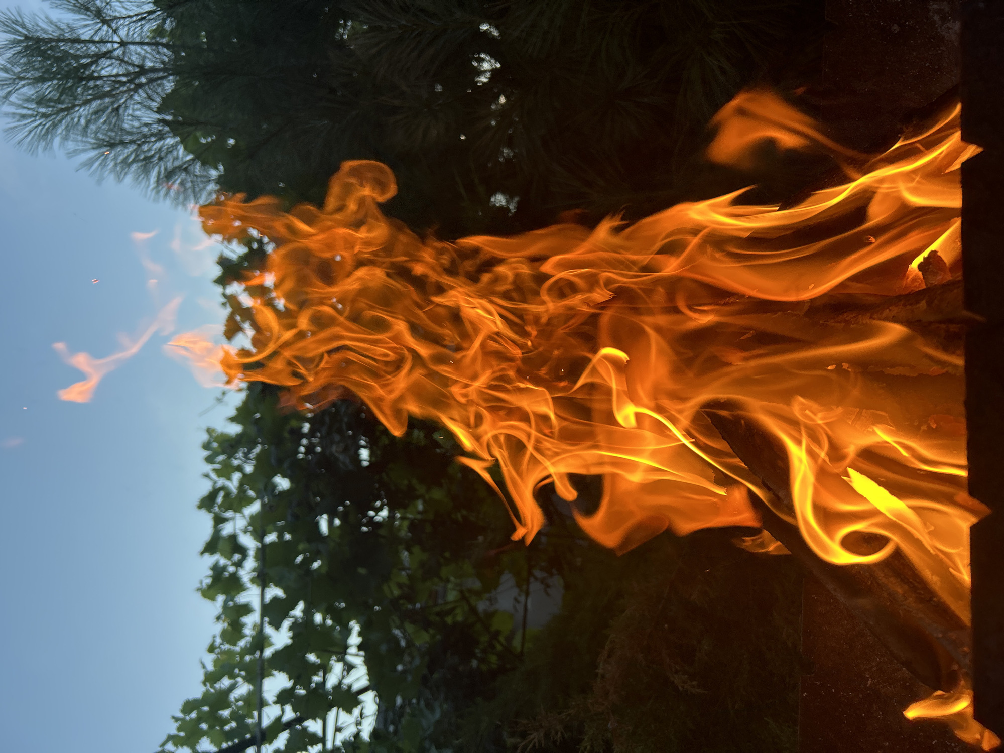 Open fire burning in a metal brazier outdoors