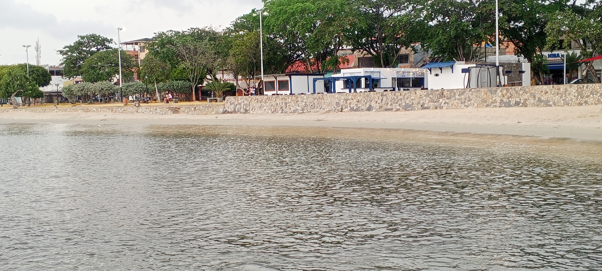 Overcast evening along Juan Griego's bay and rocky waterfront
