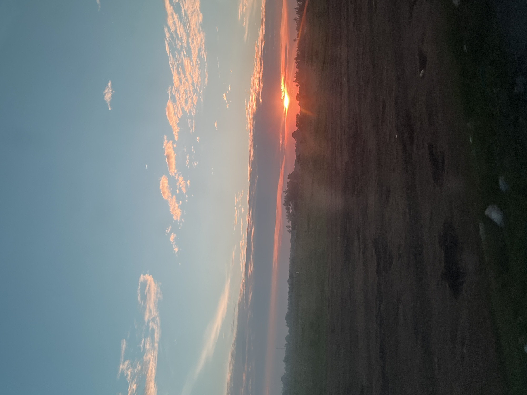 Golden hour skies over Meunasah Pupu, sun low on the horizon