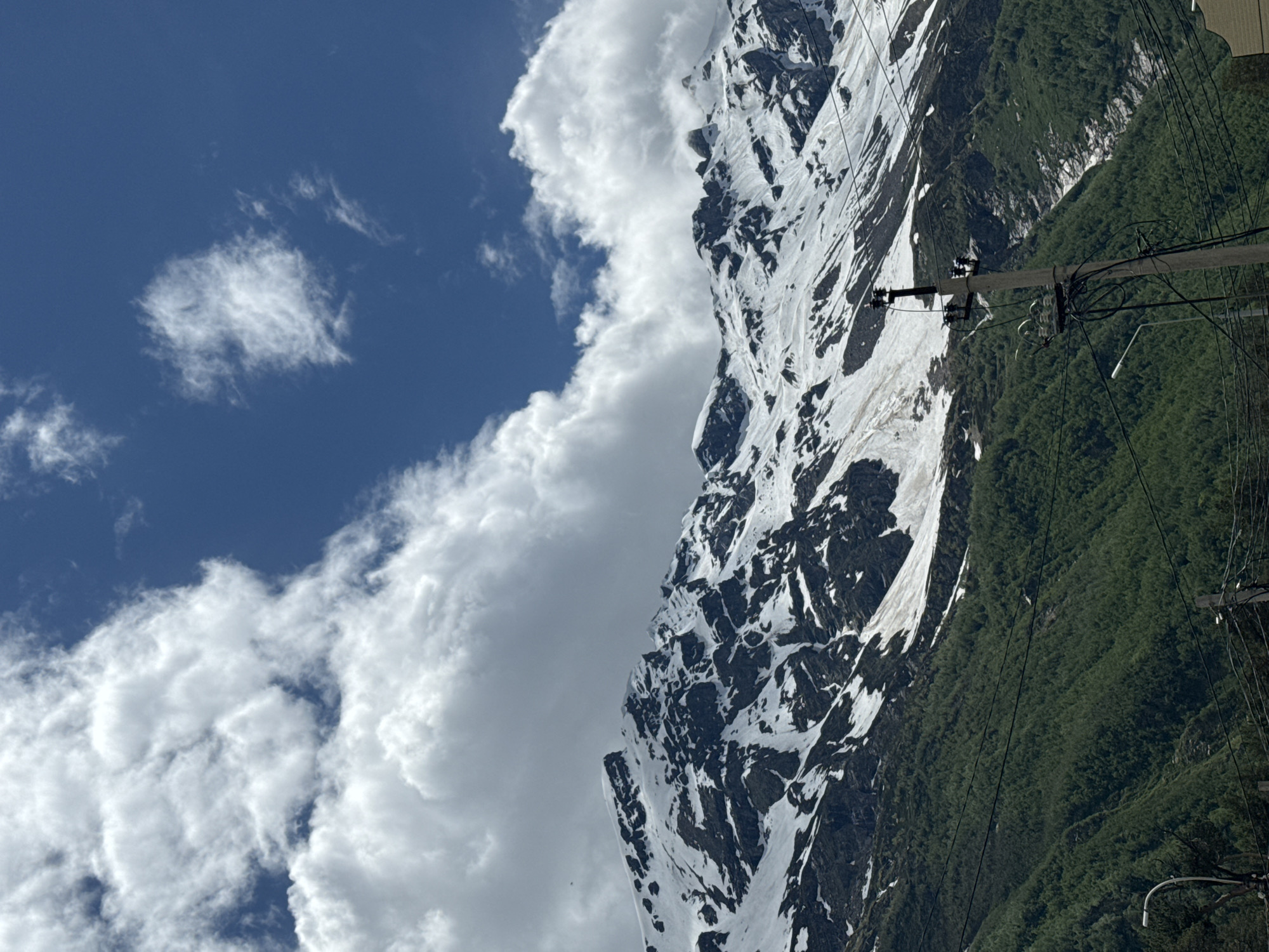 Snow-capped peaks and village paths in Terskol's Caucasus landscape