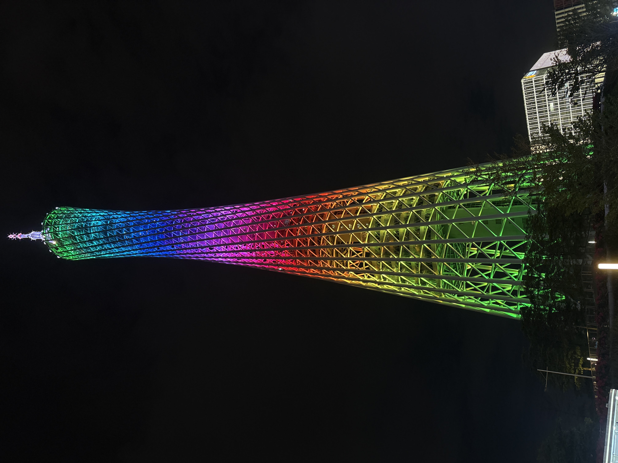 Canton Tower evening lights and Pearl River waterfront activity