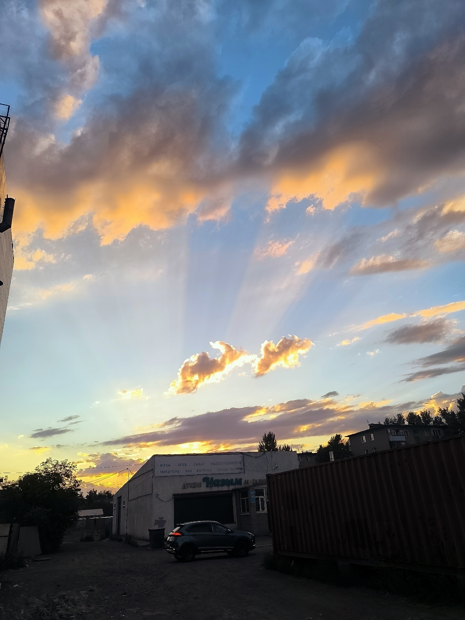 Sunset clouds glow over industrial Qarağandı, Kazakhstan