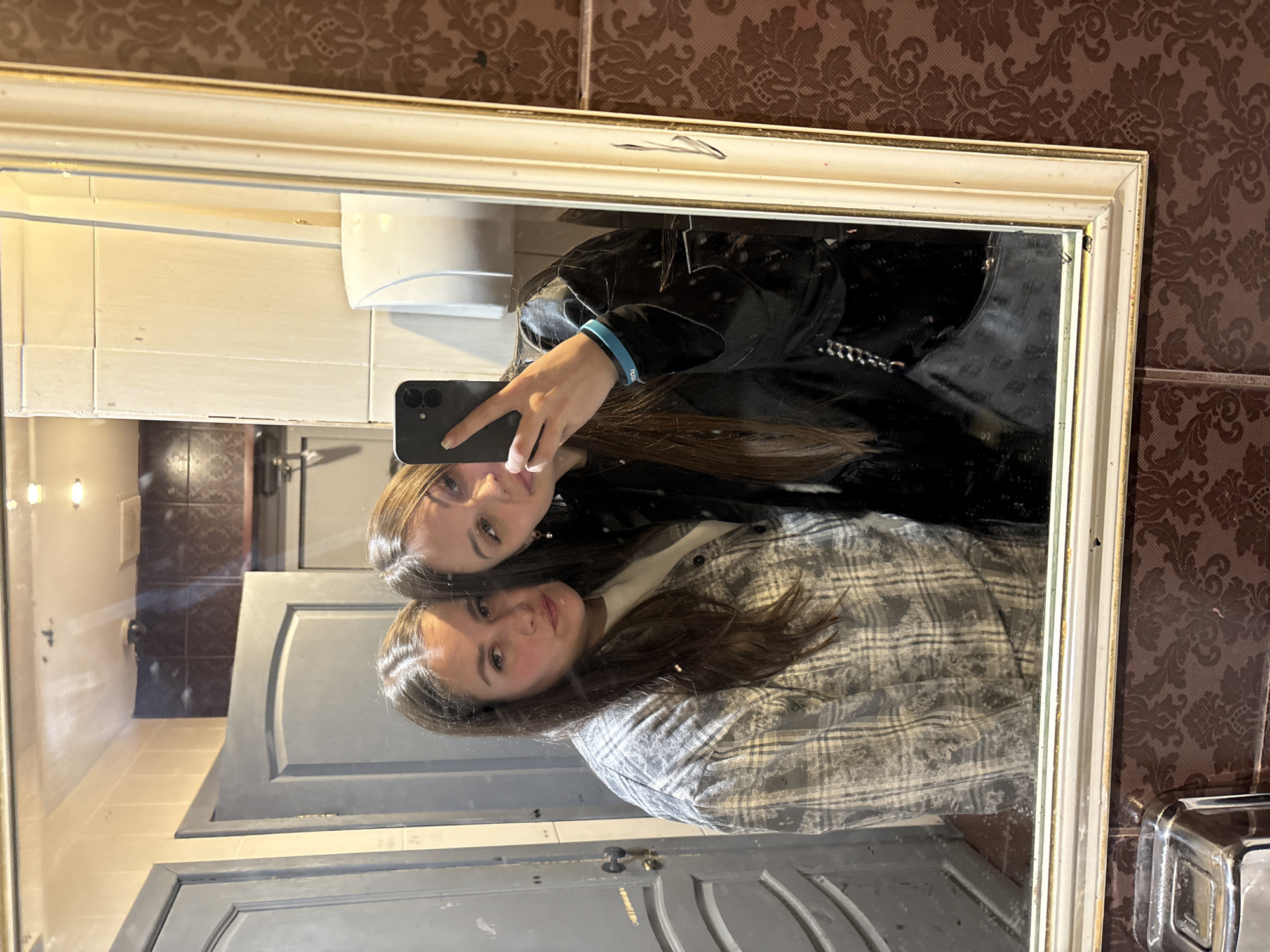 Two women take bathroom mirror selfie in Izhevsk