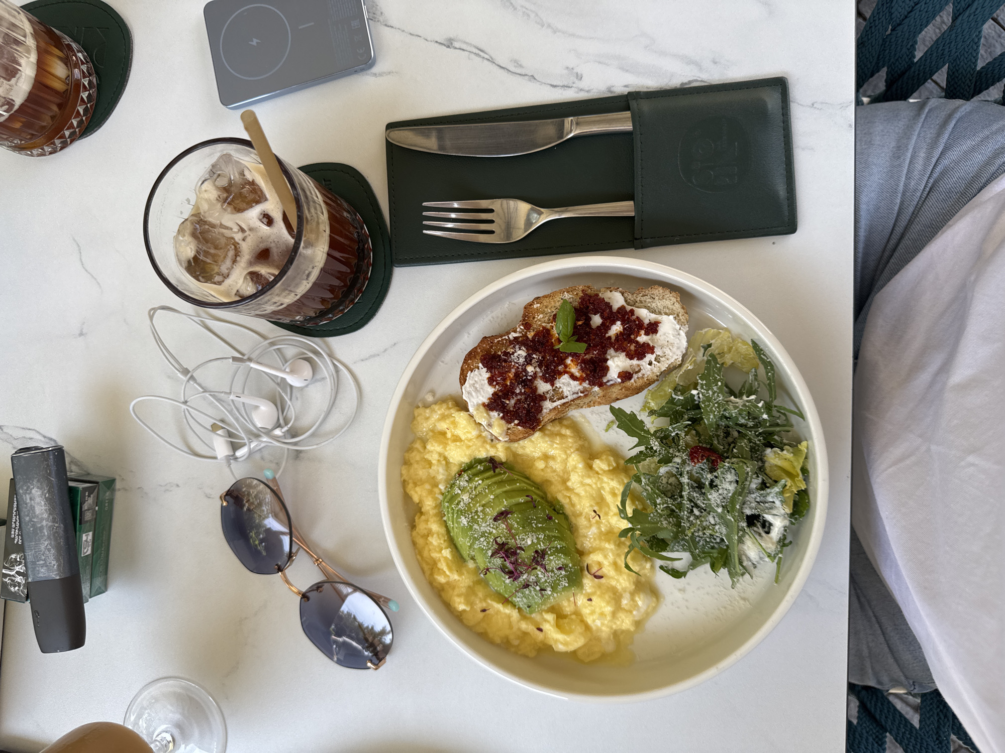 Morning table scene in Yerevan: breakfast, sunglasses, and headset