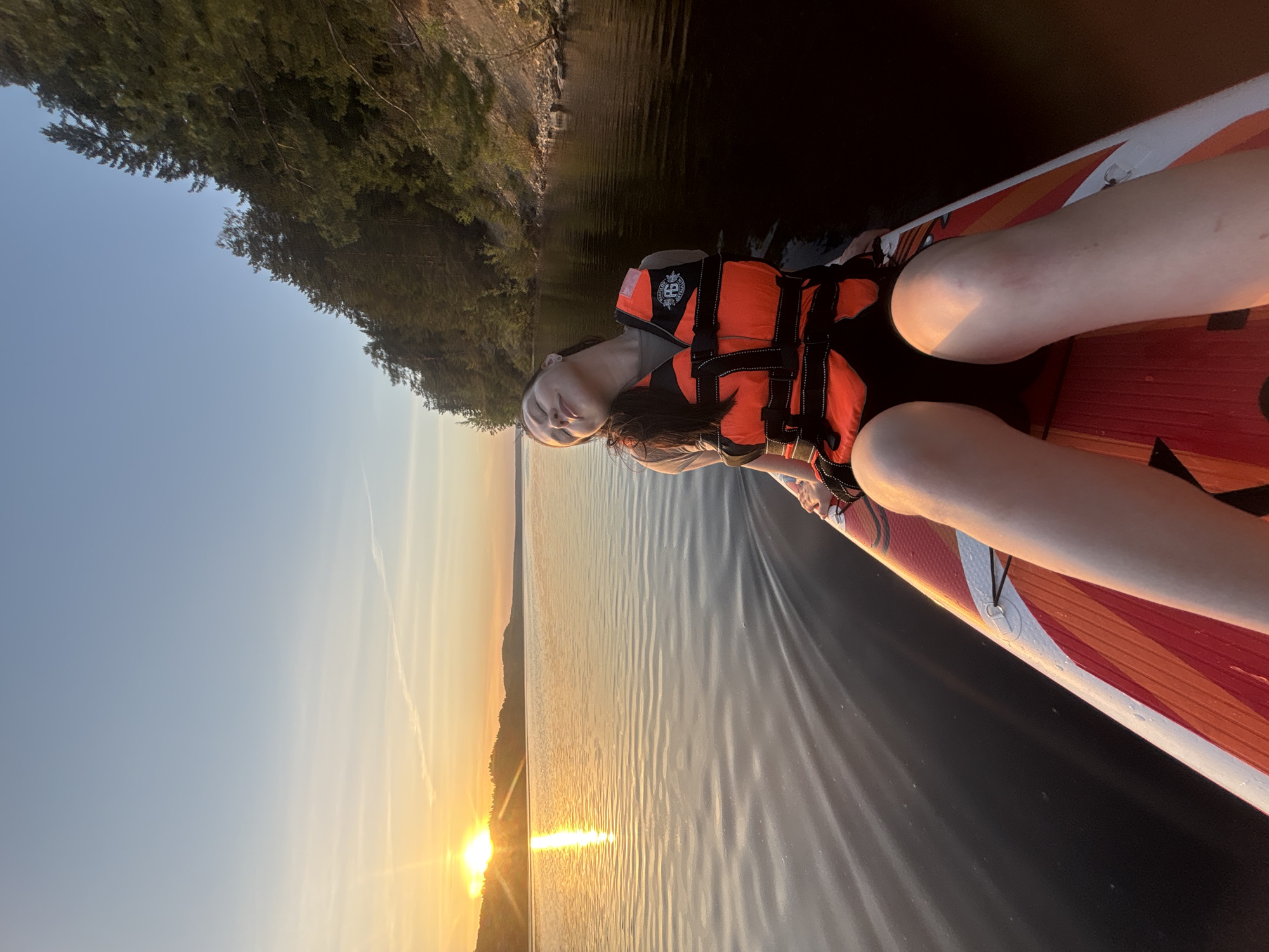 Paddleboarder enjoys sunset waters near Khokhlovka, Russia
