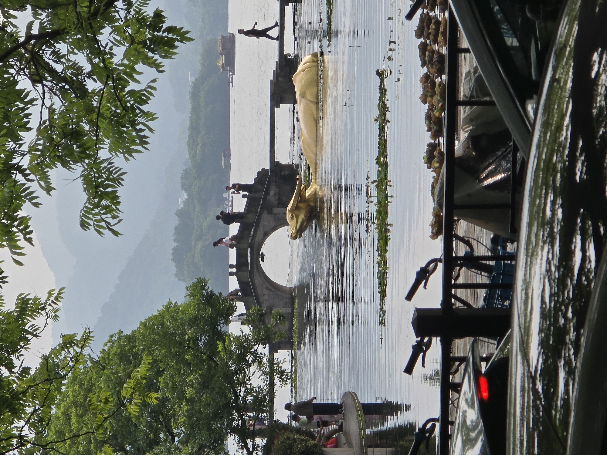 Misty lakeside morning captured in Hangzhou's Shangcheng District