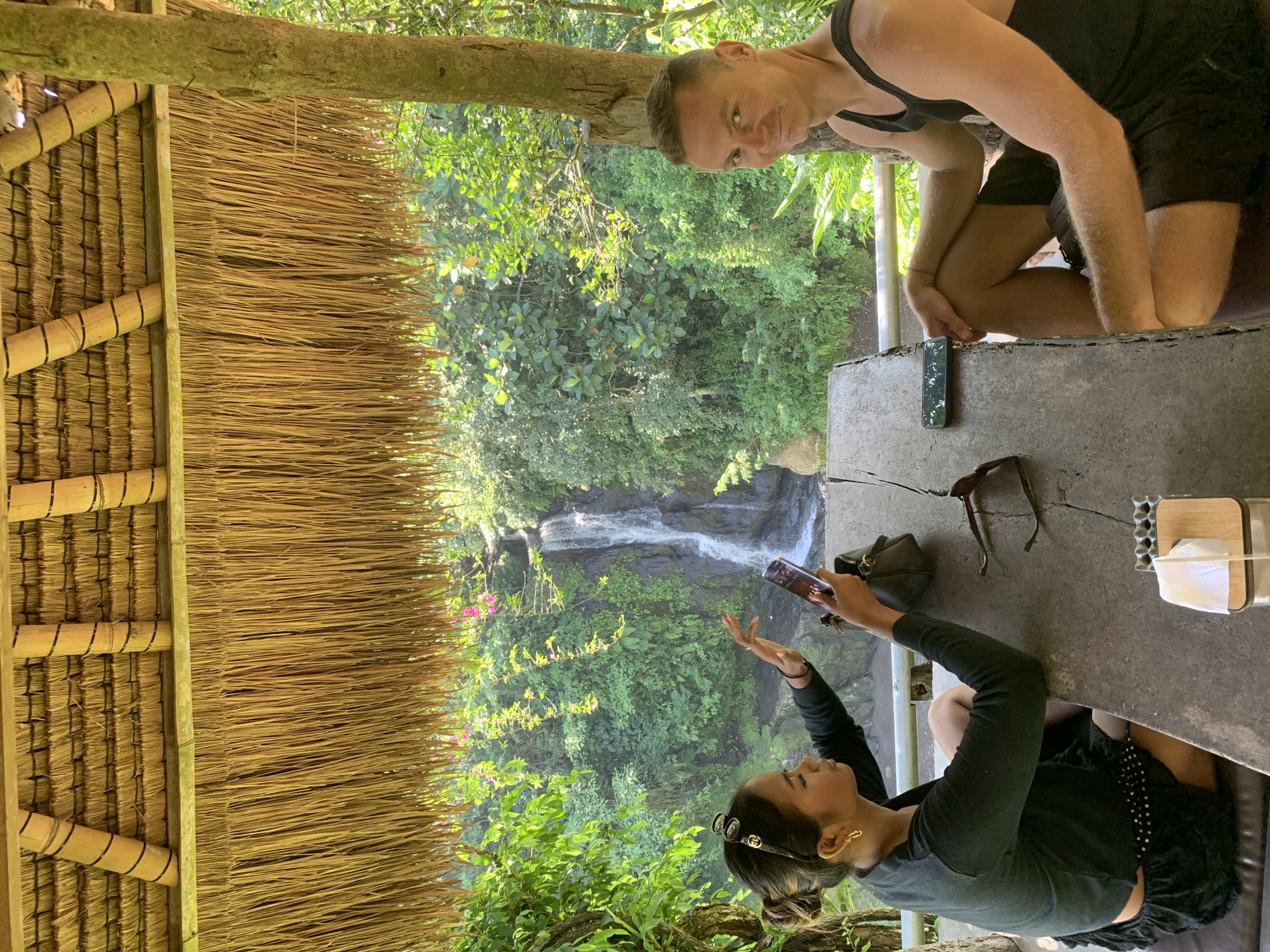 Waterfall dining experience in Blahbatuh's tropical landscape