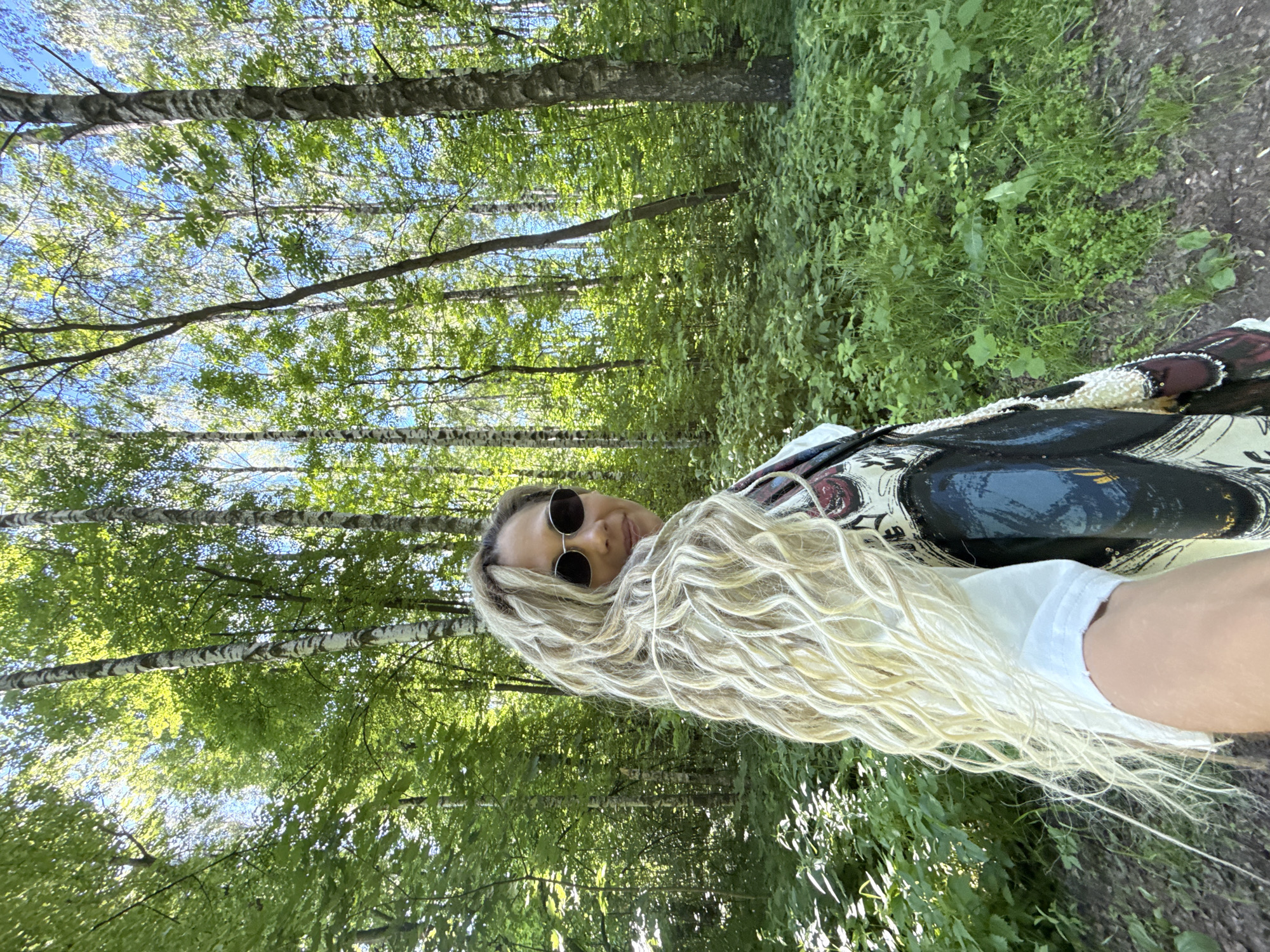 Woman photographed looking back in forest setting