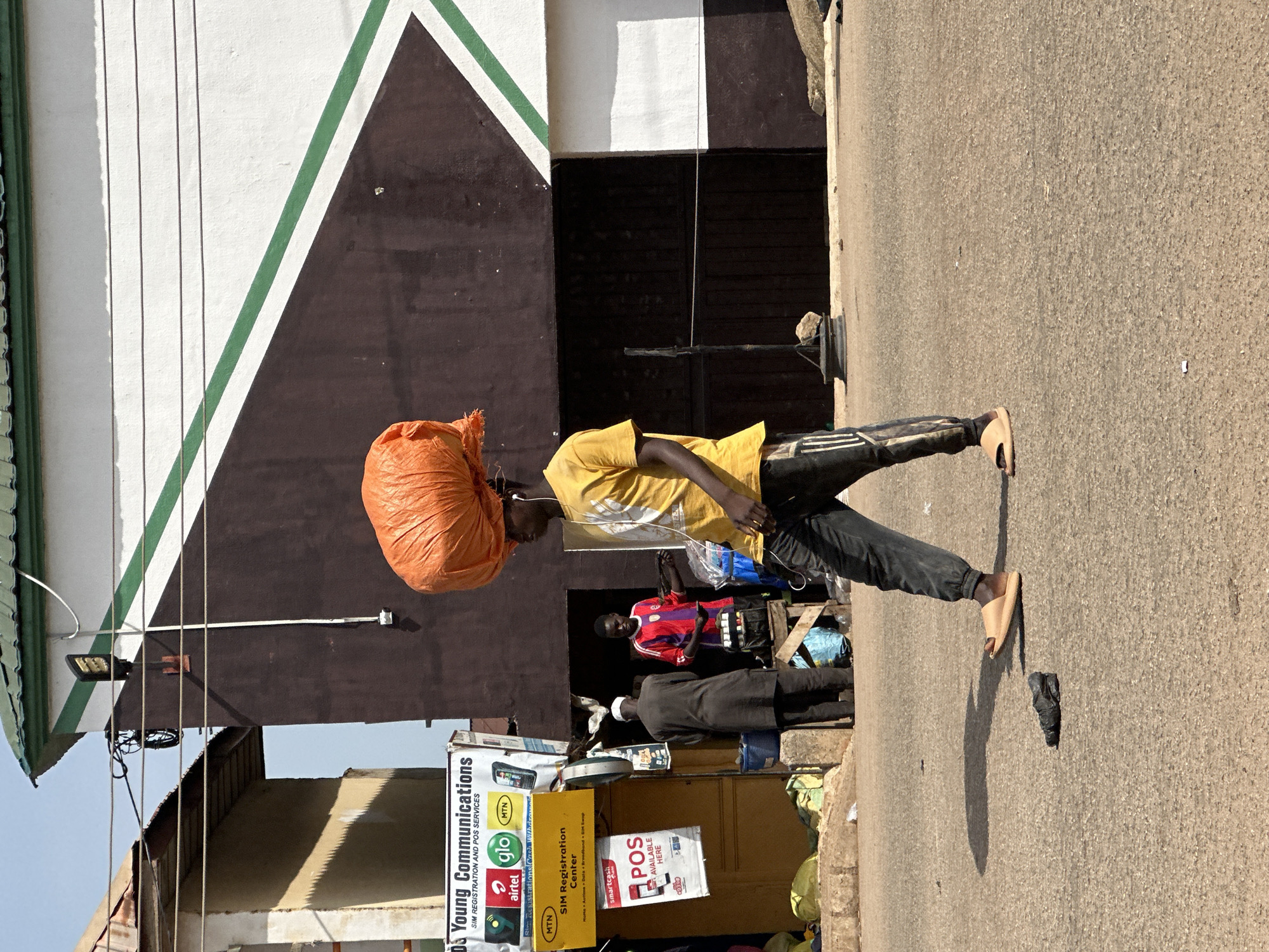 Morning street life and commerce in Bukuru, Nigeria