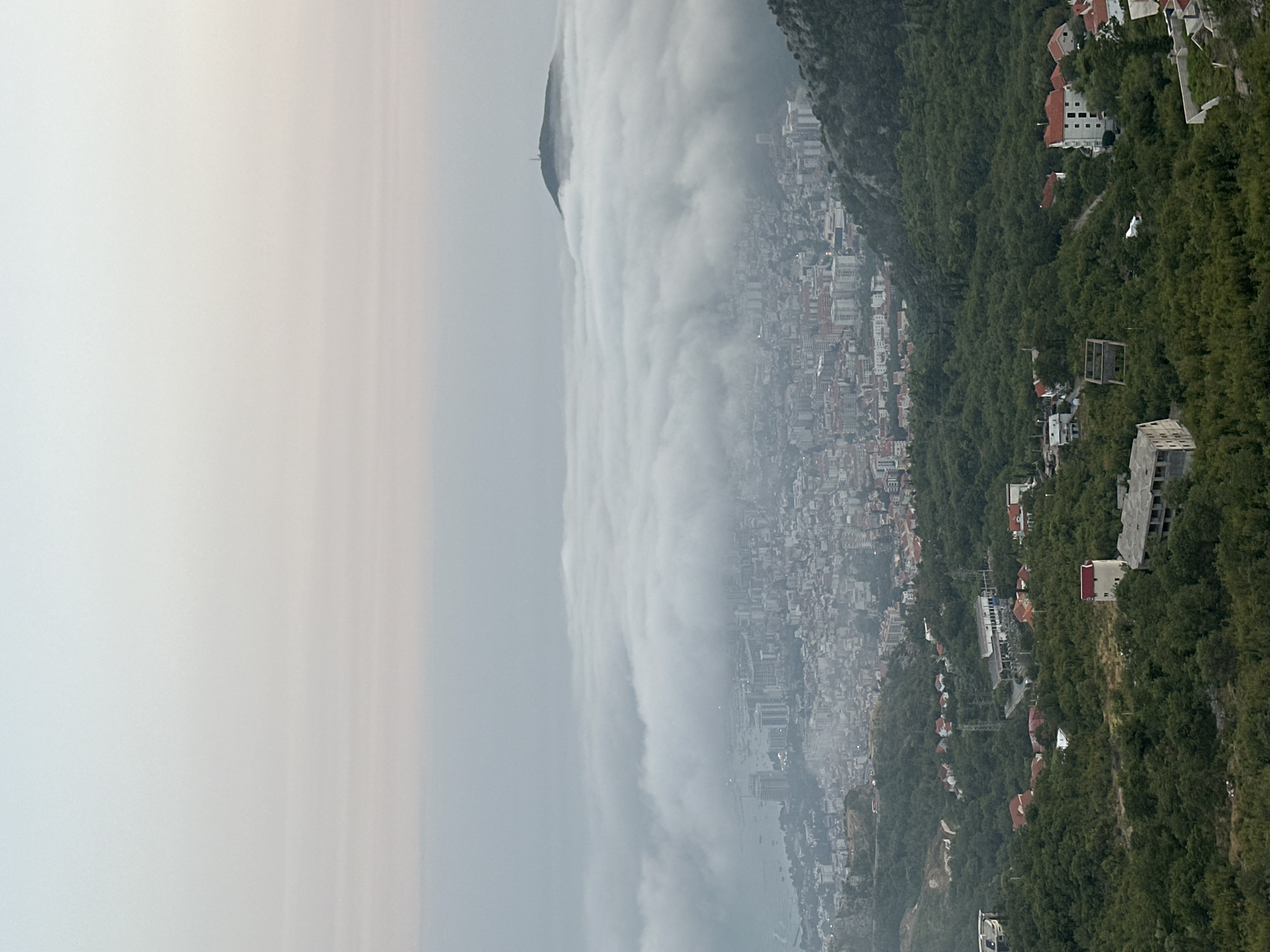 Dense fog blankets the coastline near Lapčići, Montenegro