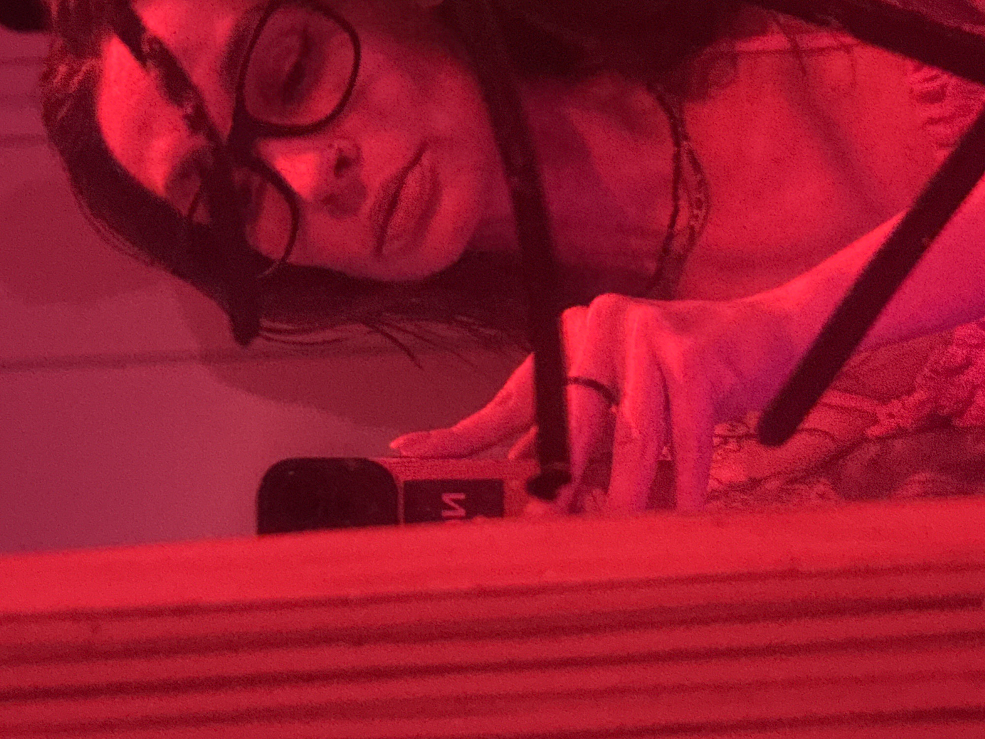Person observed under red lighting in Ramat Gan residence