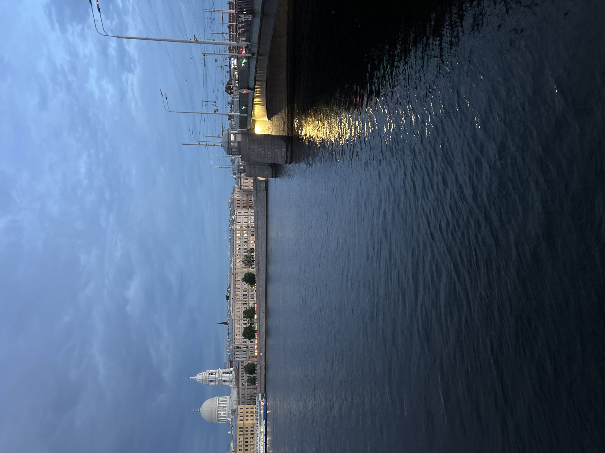 Evening waterfront scenes captured across urban river district