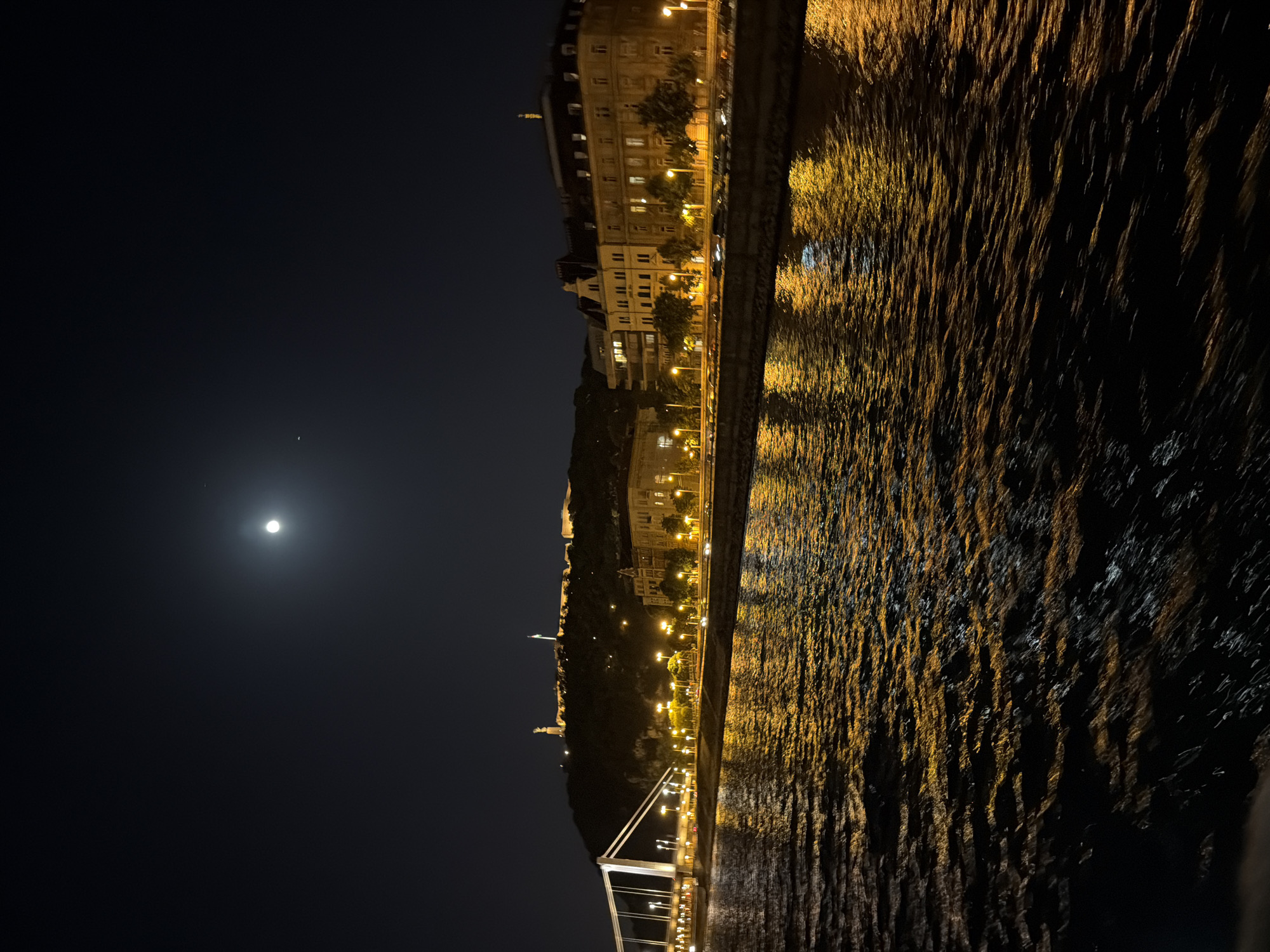Budapest cityscape illuminated along Danube River at night