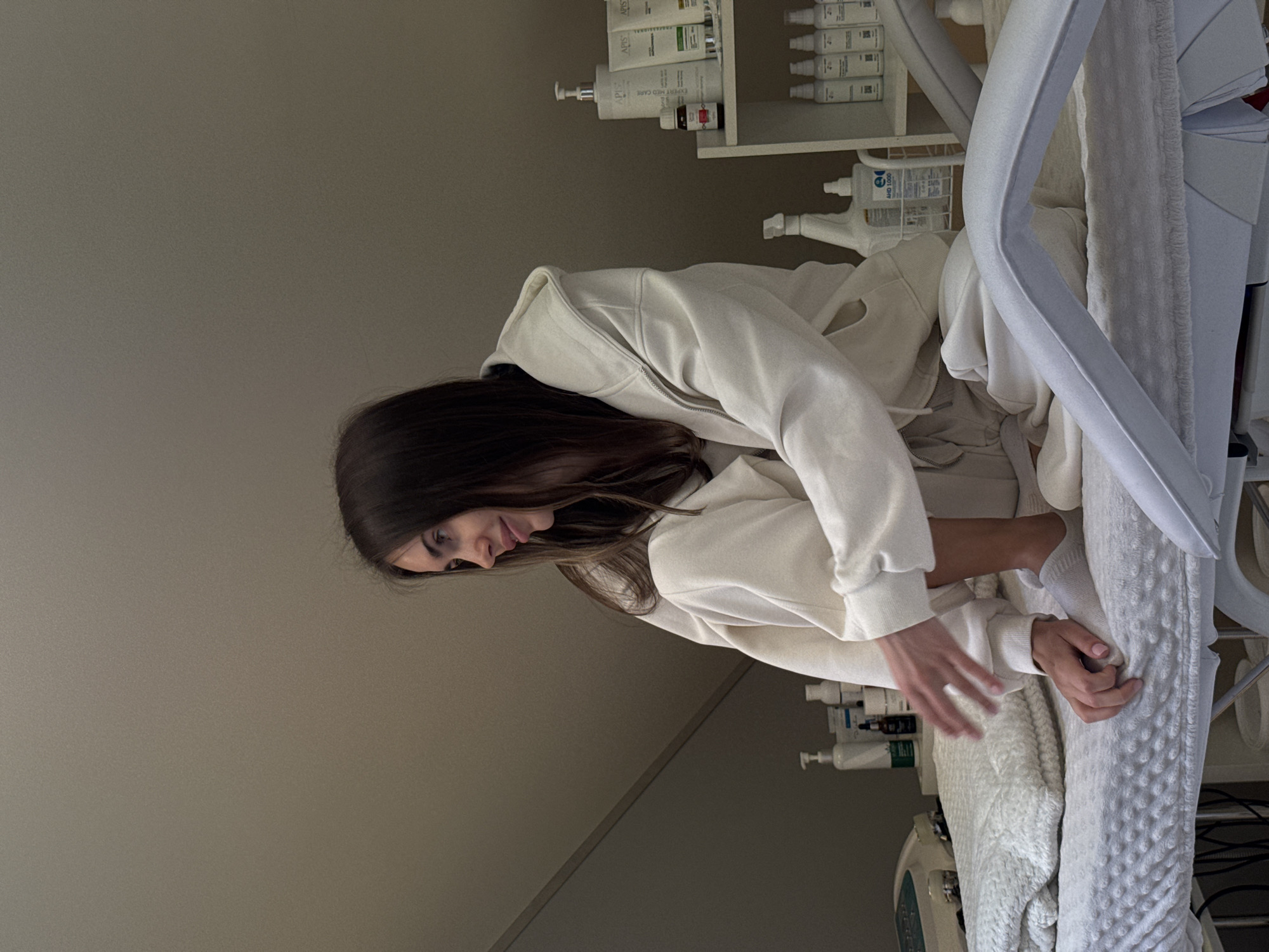 Woman receives treatment at medical clinic facility